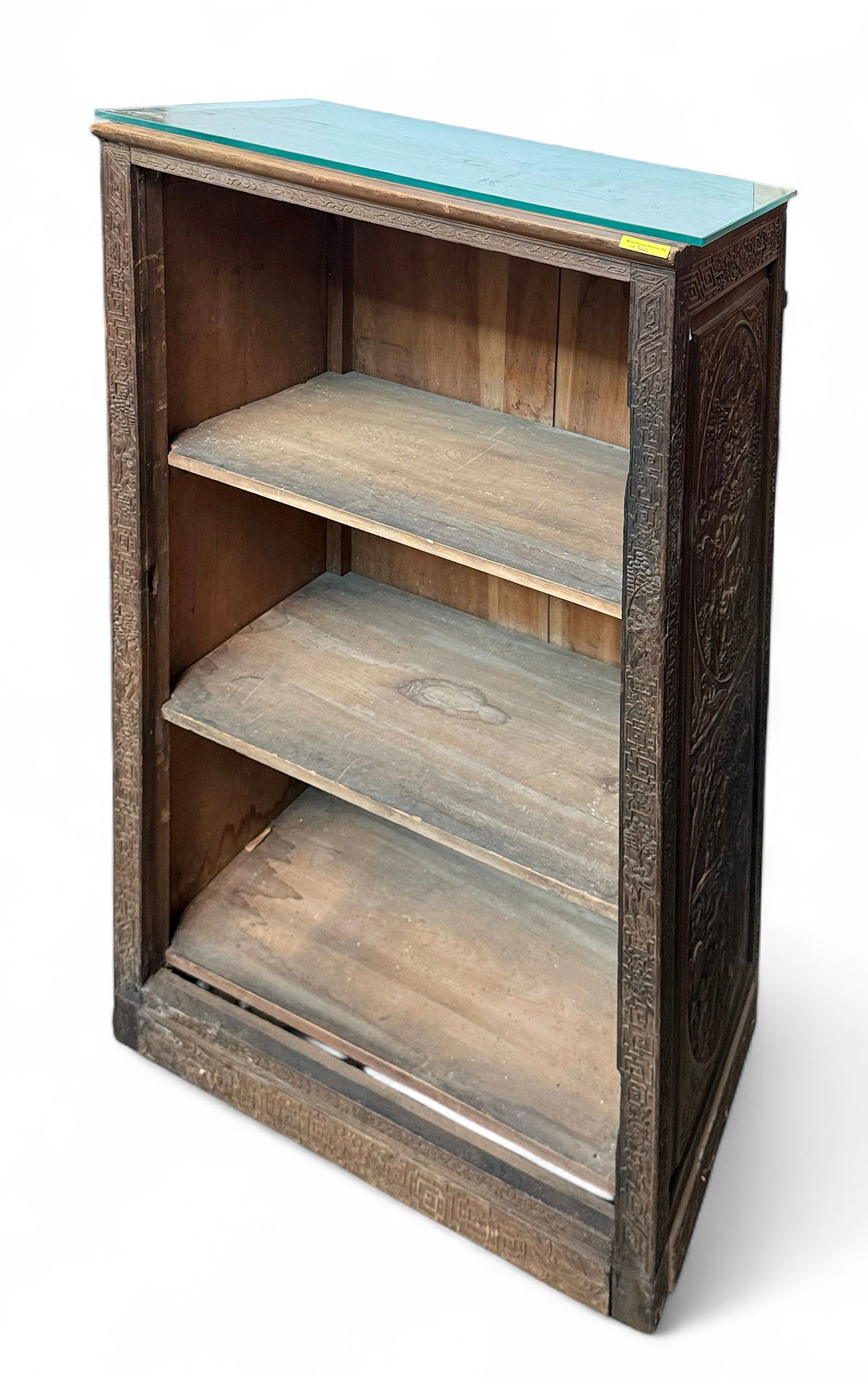 Old Carved Asian Bookcase.: The bookcase has two removable shelves. The sides are decorated with carvings of various scenes. It is well worn, but in solid shape overall. The wood is stained in areas. It measures 26" wide, 16 1/2
