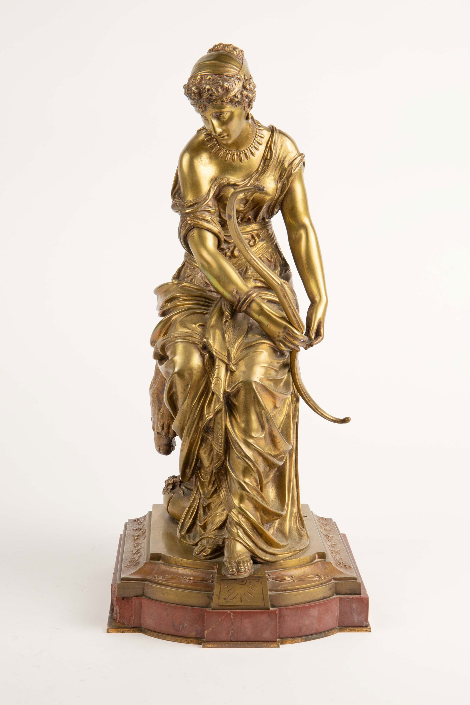 Bronze Sculpture Aft. Emile Bruchon - Ariane.: This fine antique heavy bronze sculpture sits on a red marble base. It measures 18 1/4" x 8 1/4" x 8". The left arm is loose but secure, and the bow she is holding is not attached. There are a few chi