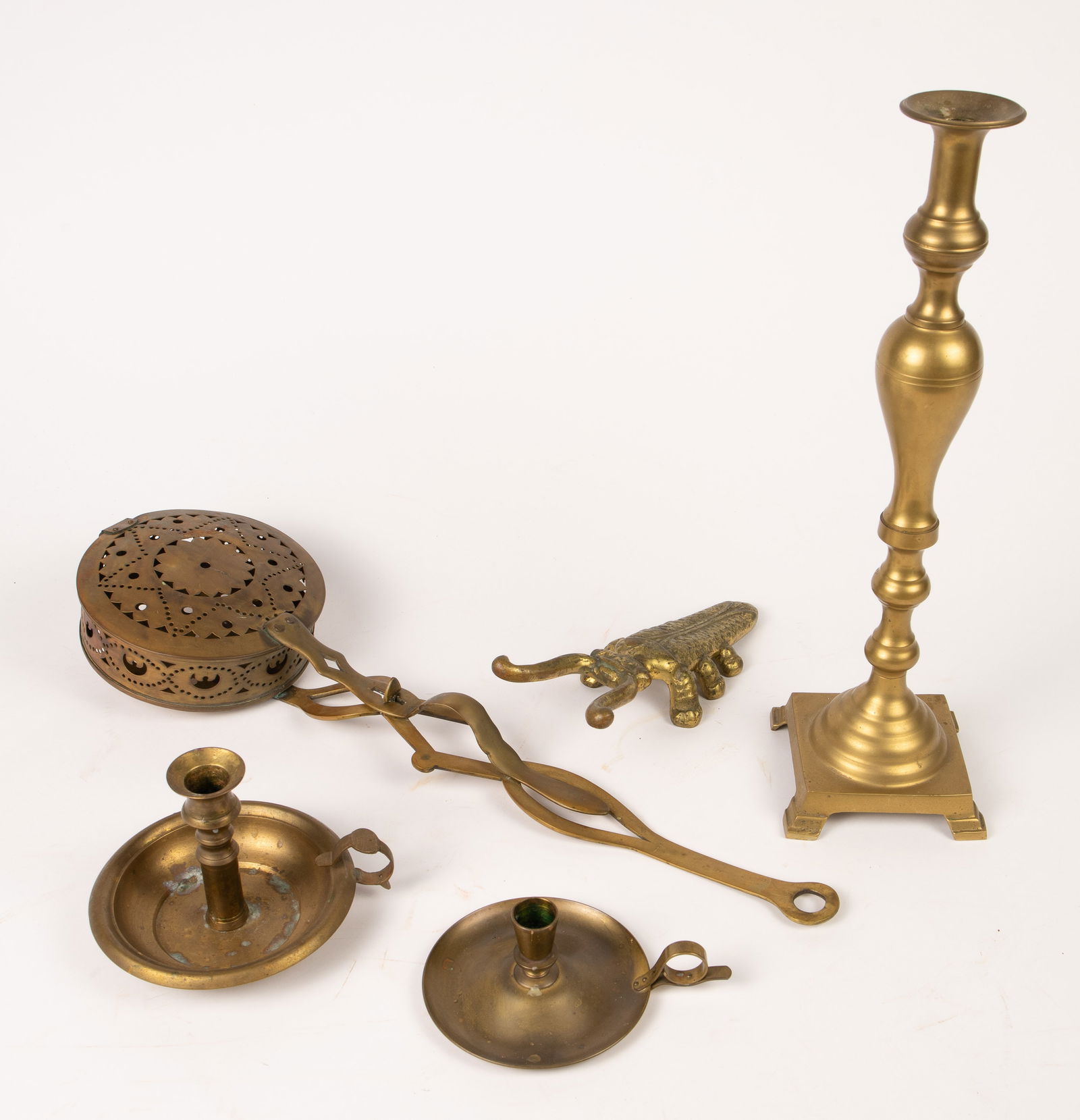 Lot of Assorted Brass Items - Candlesticks, etc.: This lot consists of 5 items: two chamber sticks, a tall candlestick, a beetle doorstop or table sculpture, and a pierced chestnut roaster. This last item is stamped, "England". It is the largest item