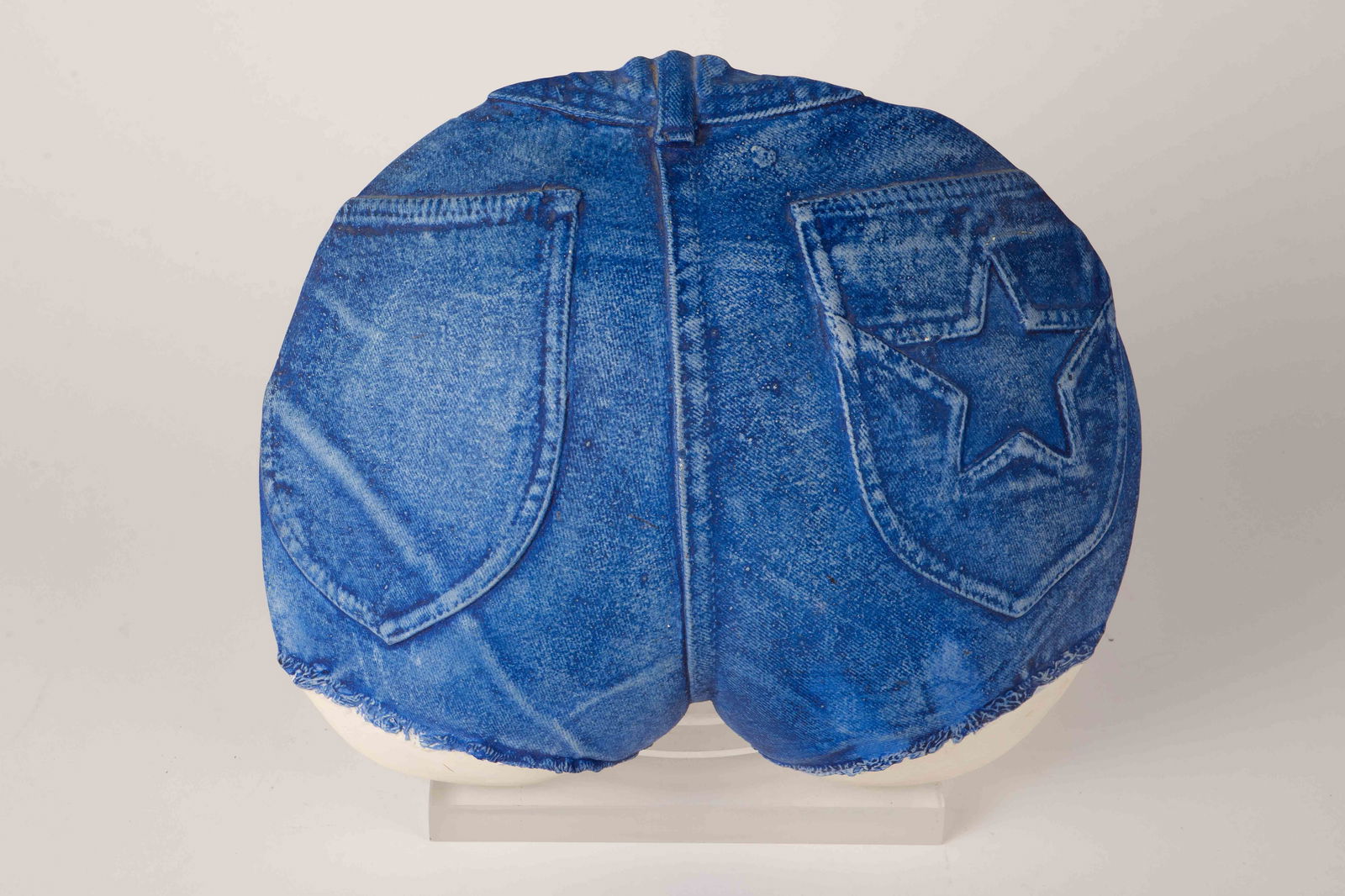 Marc Sijan Ceramic Wall Sculpture, "Blue Jeans".: The sculpture is hand signed Marc Sijan, and copyrighted 1976 on the back. It measures 12 1/2" x 10 3/4" x 3". There are a few stains on the piece. Otherwise, it is in overall good condition.
