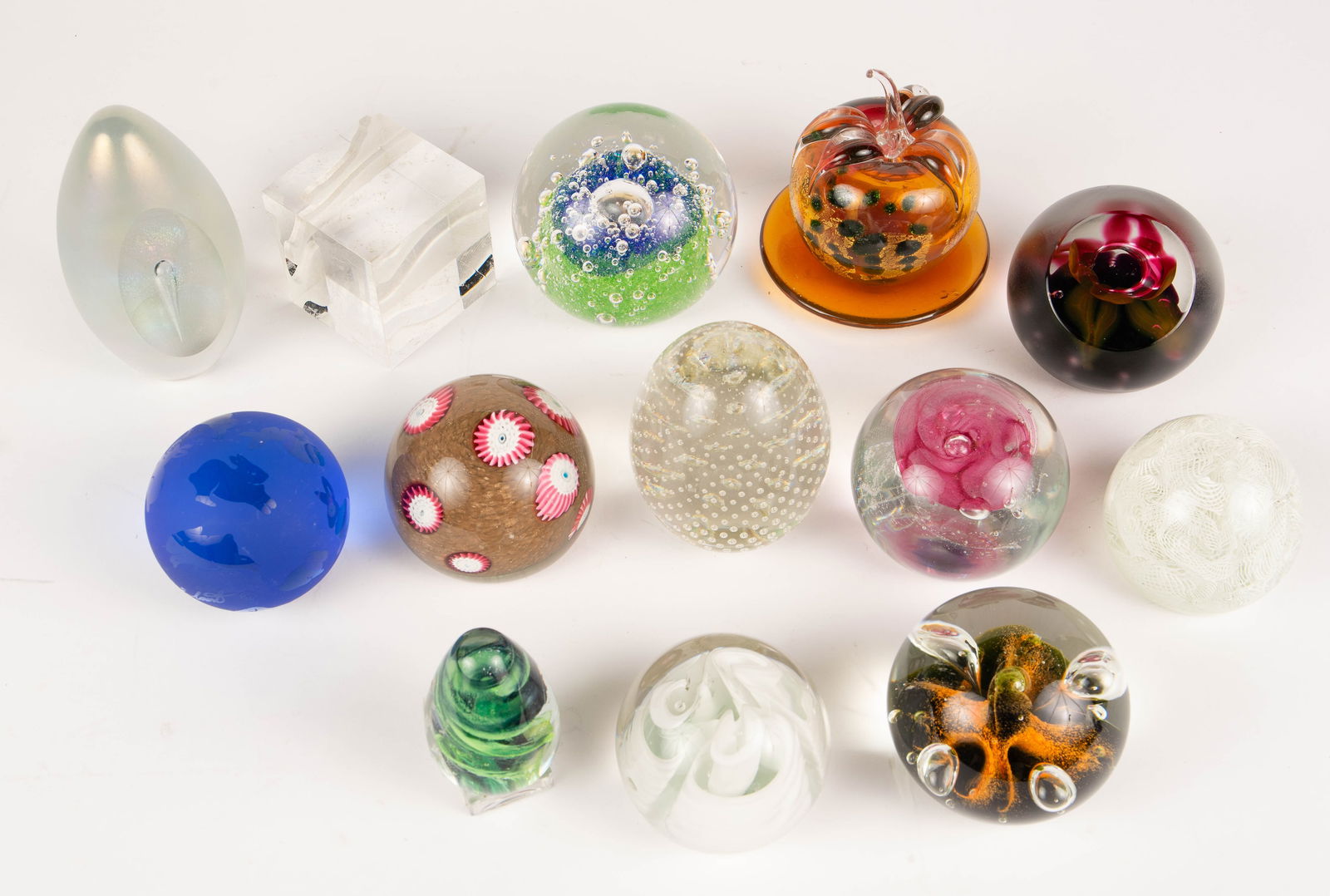 13 Glass & Crystal Paperweights - Steuben, Murano.: The lot contains 13 paperweights, many of them signed. The signatures observed are Steuben, A & E Lont, Caithness (2), Goran Warff for Kosta, Neurot, Kerry Glass, Audrey Handler, and Eickholt. The sma