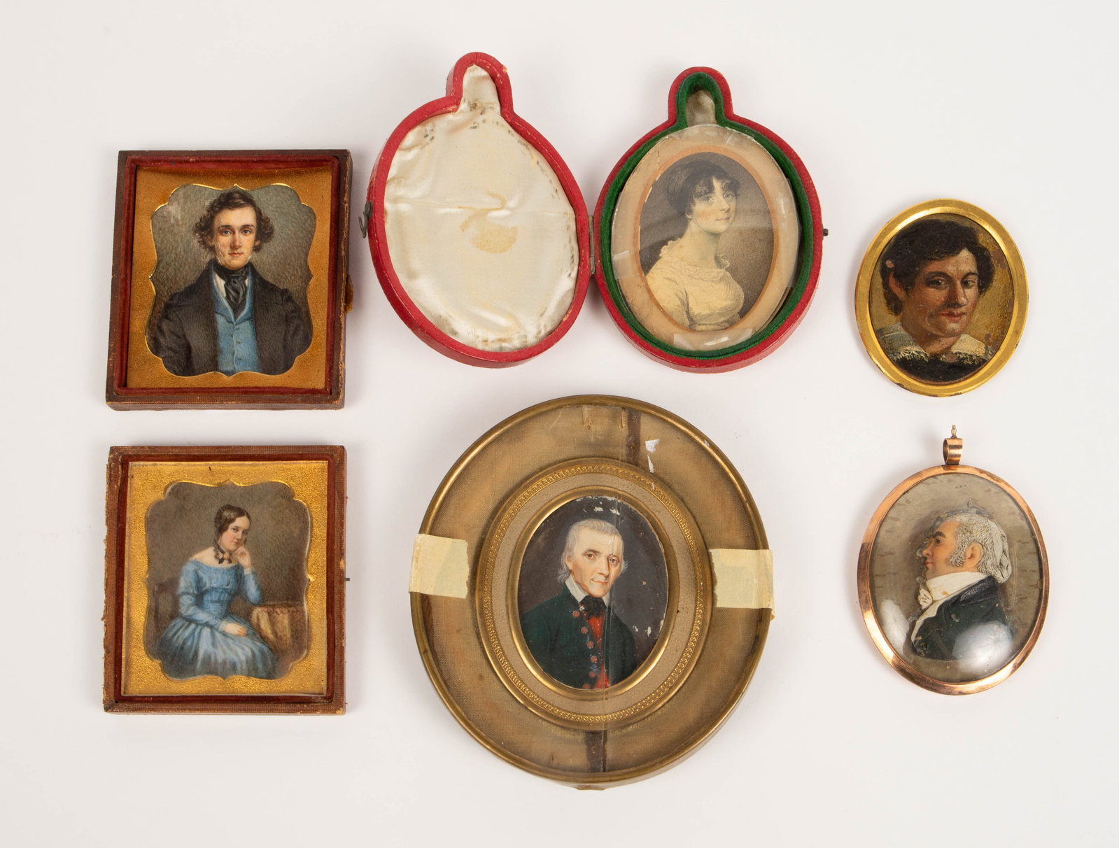 6 Old Miniature Portraits, Mostly Hand Painted.: One of these is a 19th century wax portrait. It is loose inside its frame. This piece is in a gold filled bubble case. The others are all hand painted. One of these is a watercolor. The frame on the l