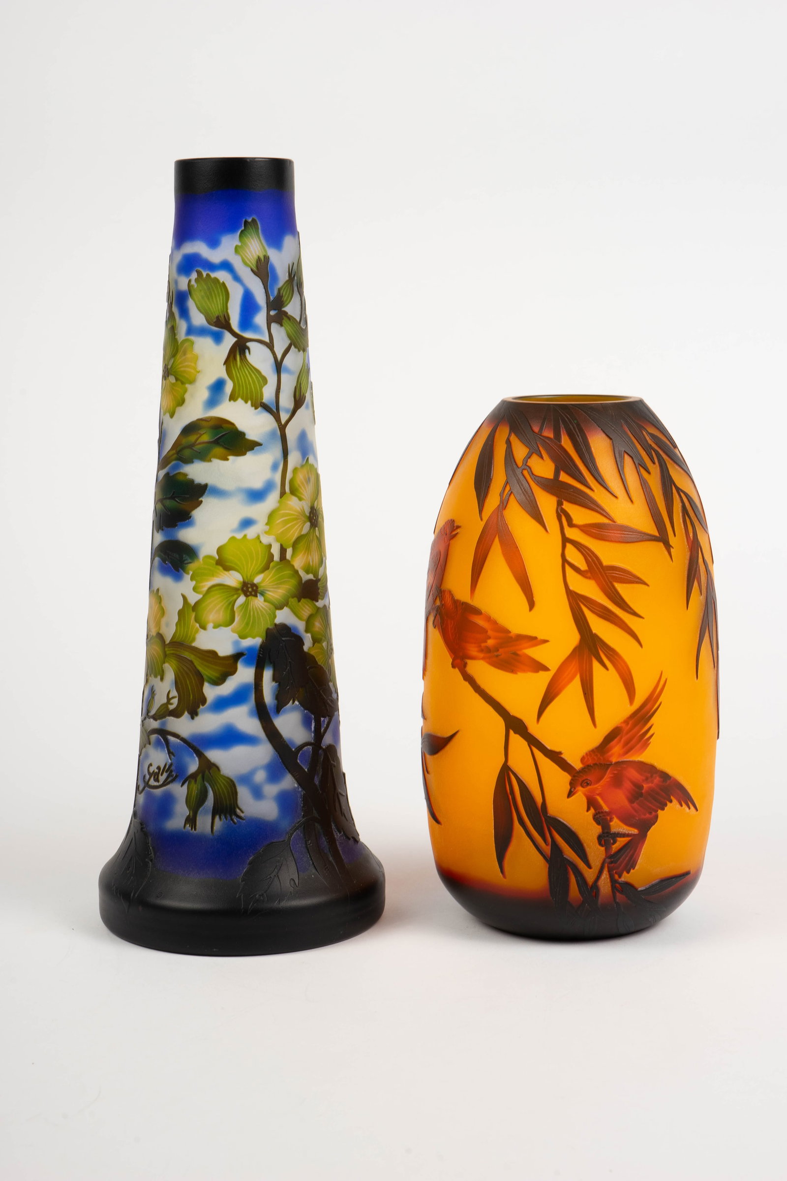 Lot of 2 Cameo Glass Vases- Flowers & Birds.: They are both marked, "Galle", but are reproduction pieces done in the style of Galle. The shorter orange vase is decorated with birds and leaves. It measures 10" tall and 4 5/8" across the widest are