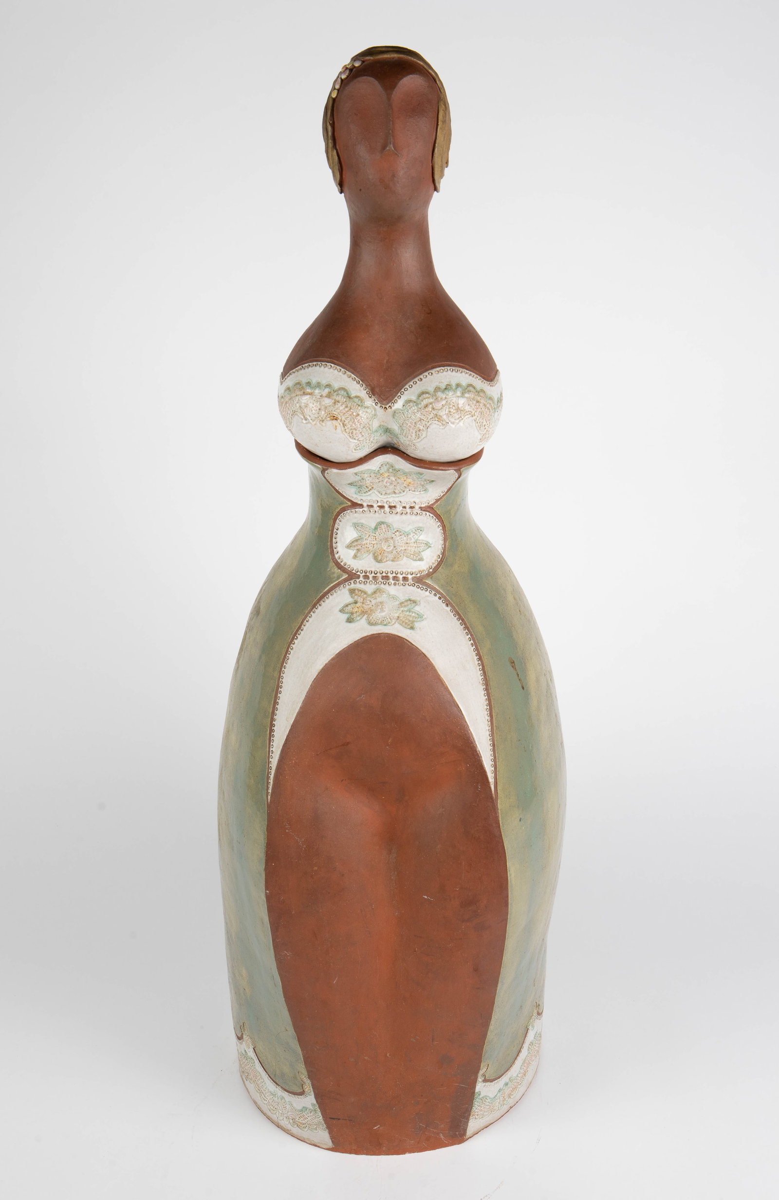 Large Mod Figural Terracotta Vessel of Woman.: This unique terra cotta art piece is unsigned. It depicts an abstract woman in a dress. The piece separates at the bottom of the bust. It measures 34" x 11" x 13" (with the head on). There is a crack 