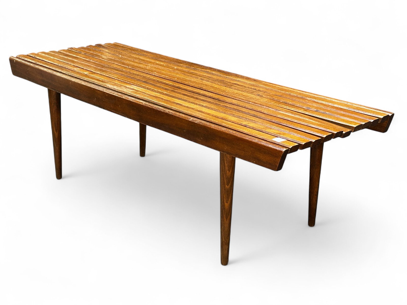 Mid Century Modern Wood Slat Bench.: The bench was made in Yugoslavia. It measures 15 3/4" x 48 1/4" x 18". One of the slats is warped down at one end, and there are some scratches and stains on the piece. Otherwise, the bench is in over