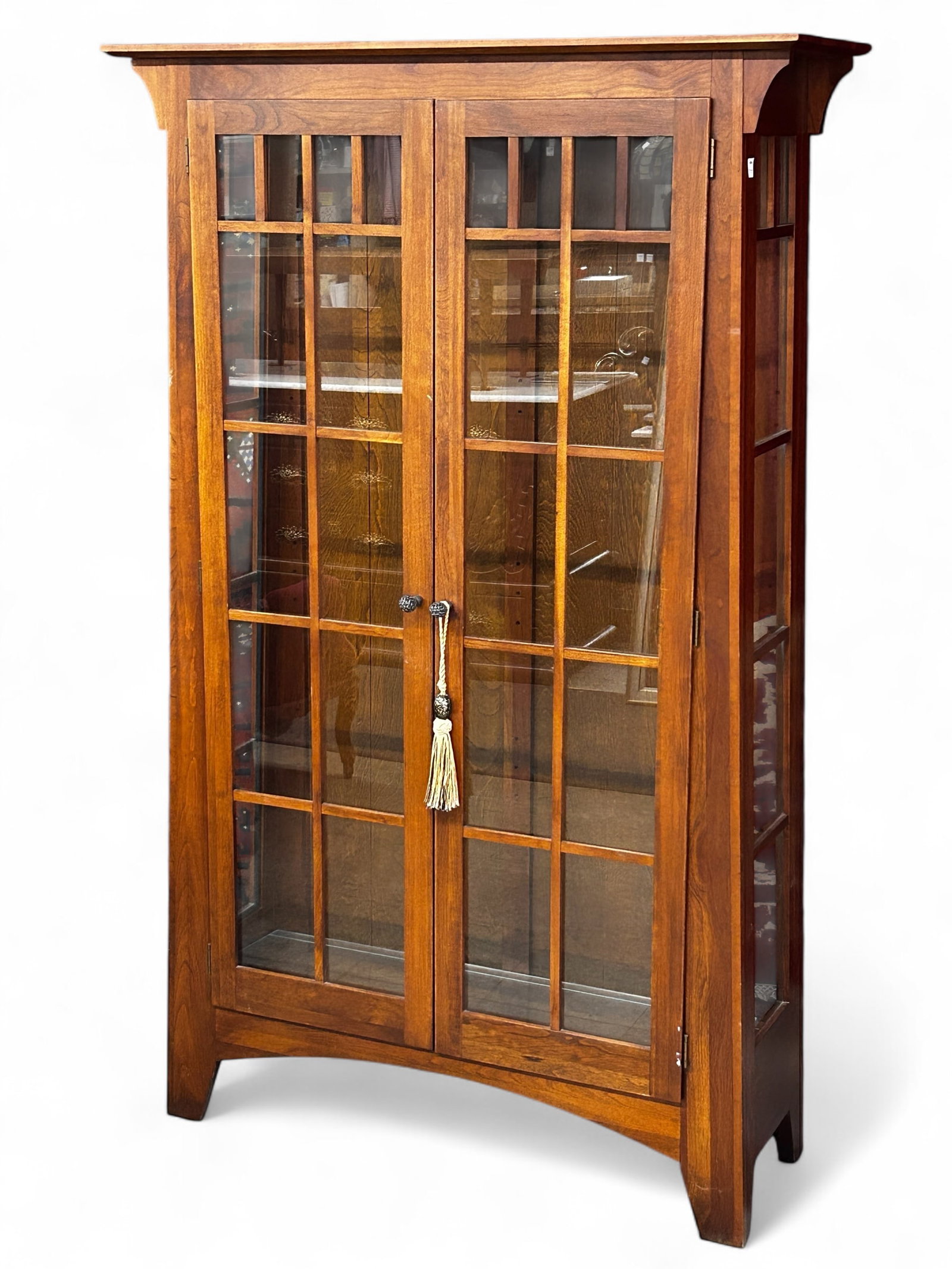 Mission Style Display or Curio Cabinet.: The medium tone wood cabinet features a glass front and sides with a wood grid trim. It has fittings for 3 glass shelves. It measures 70" x 41" x 13 3/4". There are some stains and scratches on the pi