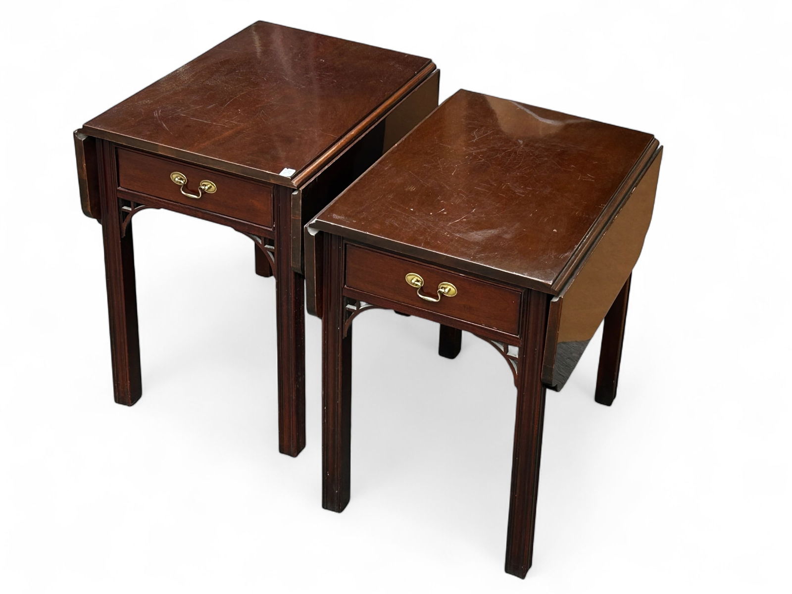 2 Chinese Chippendale Pembroke Style Side Tables.: The pair of mahogany drop leaf tables were manufactured by Hickory White as part of the "American Masterpiece Collection". They each feature one drawer with a brass pull and pierced fretwork. The drop