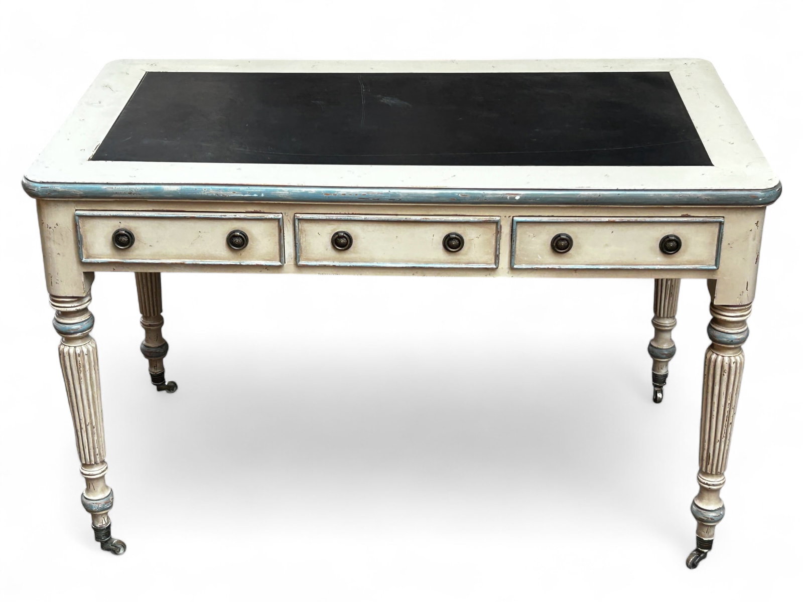 Small French Style Painted Desk or Library Table.: The desk is painted white with a black inserted leather top. There are three drawers, along with multiple faux drawers on the sides and back. It features brass hardware, and carved round legs with bra