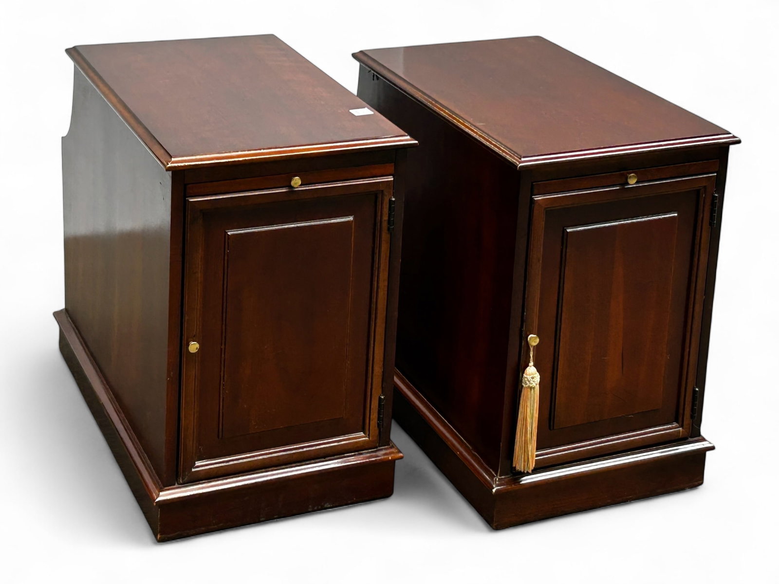 Pair of Lane Magazine Rack Side Tables.: The tables each have a pull out shelf, a single door with interior storage, and a magazine rack on the back. Both tables have the manufacturer's label on the underside. Overall, they are in good condi
