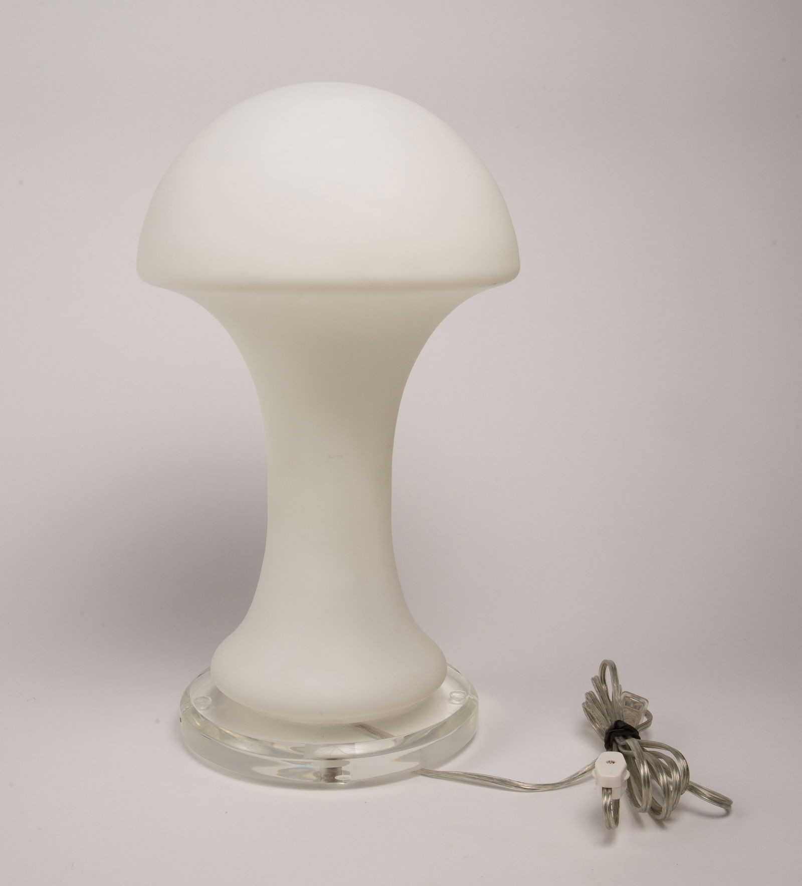Gino Vistosi Style White Mushroom Lamp.: It is an unsigned lamp with a lucite disc base, and a white mushroom glass shade. The shade has a few small dark marks, but overall, the piece looks to be in good condition. It measures 17 1/2" tall a
