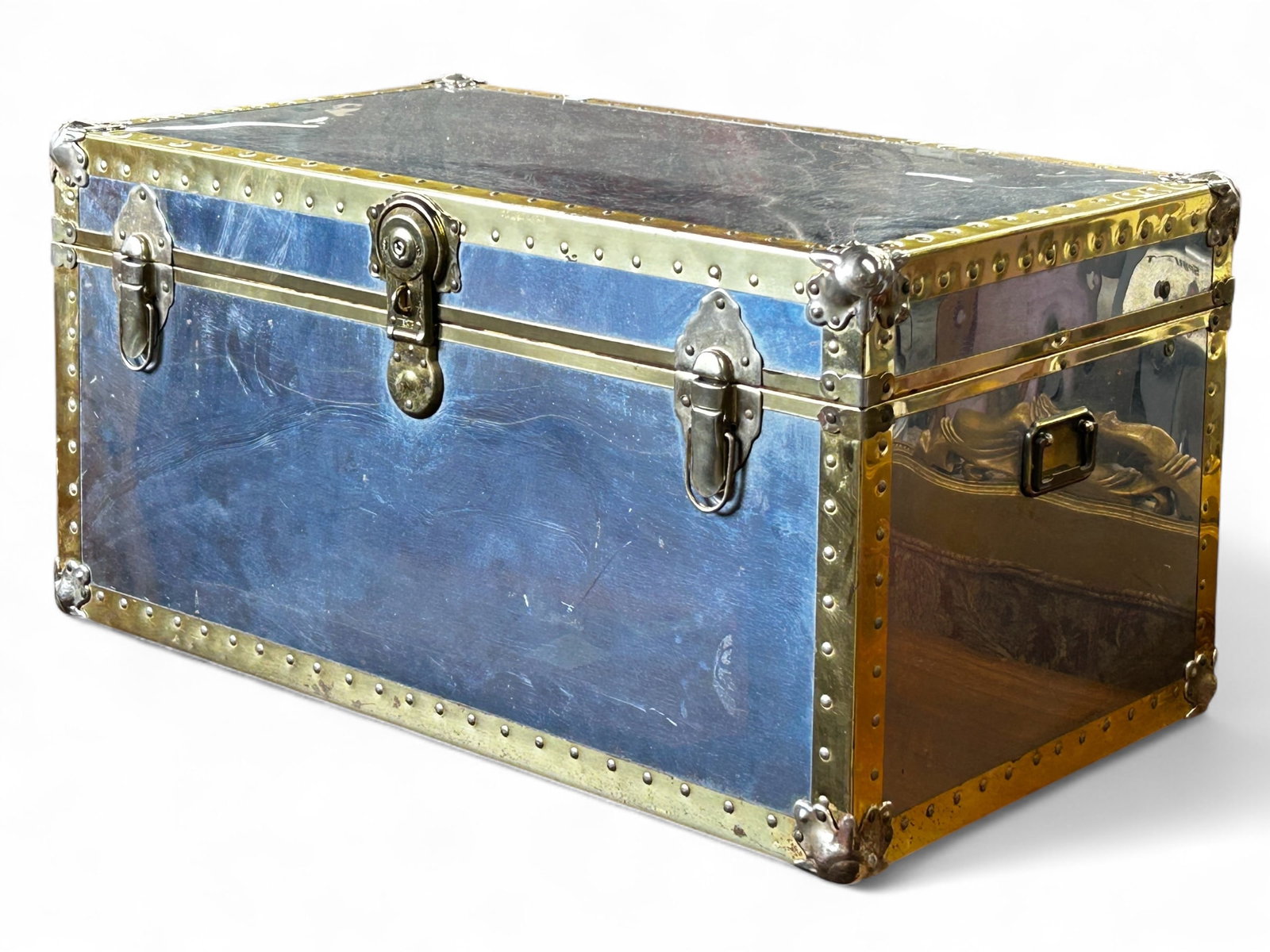 Brass and Metal Trunk.: The trunk has a nailhead design, and has handles on either side. It is currently locked, with no key included. Anything (or nothing) could be inside! There are scratches on the trunk, as well as a bit