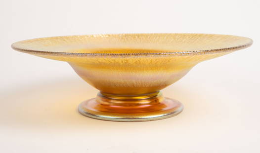 L.C.Tiffany Favrile Iridescent Bowl.: The bowl by Louis Comfort Tiffany is signed on the underside, although the Fs appear to be incomplete. It measures 2 3/8" x 8 1/8". It is in overall very good condition. In-house shipping is available
