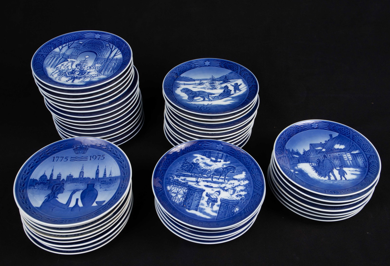 Group of Royal Copenhagen & Jensen Year Plates.: The lot includes 49 collectible porcelain plates. There are 47 Royal Copenhagen plates, including 40 year plates from 1980s-2009 (several repeats). The lot also includes 2 Georg Jensen year plates: 19