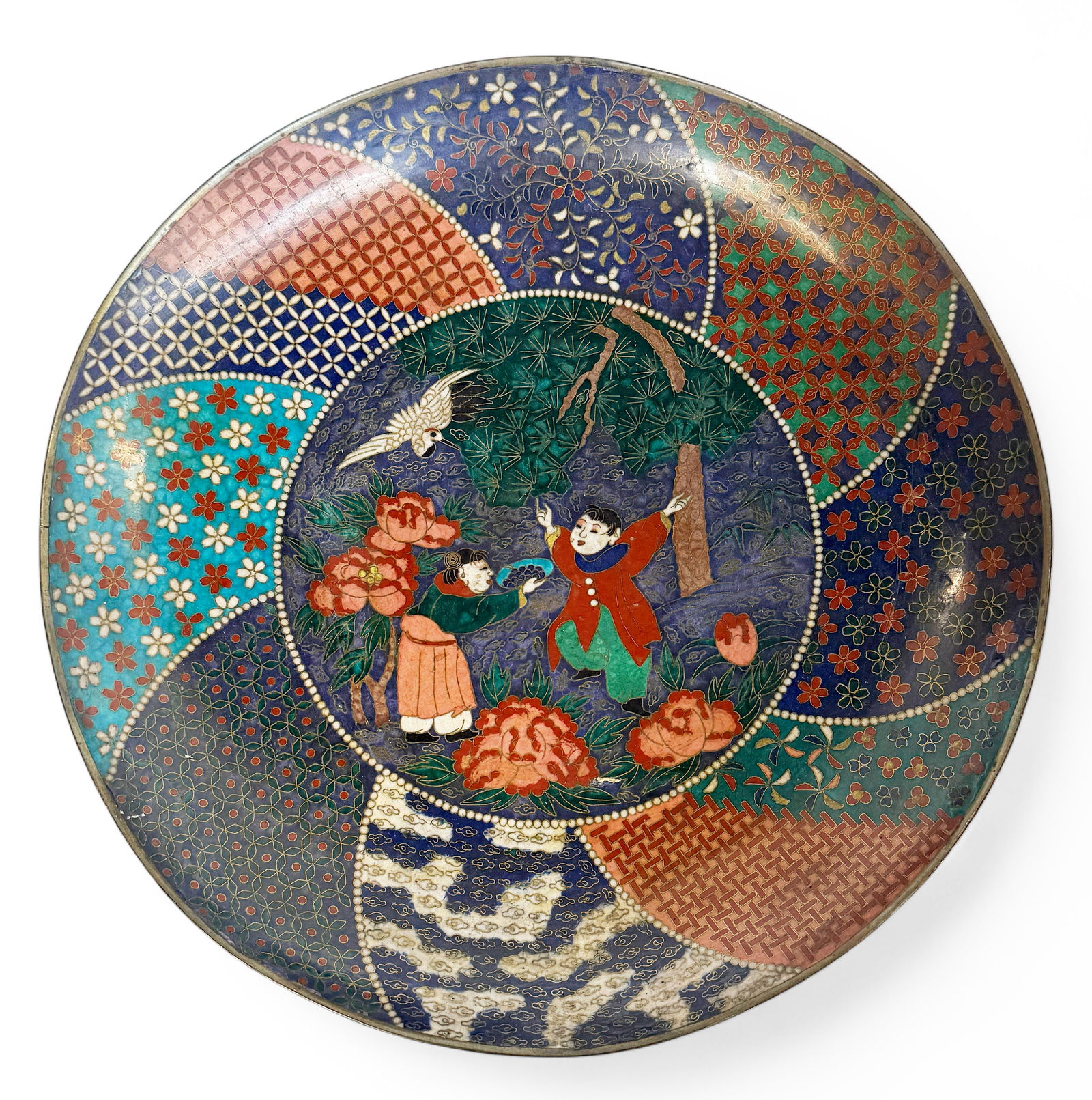 Large Meiji Period Japanese Cloisonne Charger.: The charger has a scene with two Japanese figures on it. It has a bit of a loss to the back side of the charger, and a small dent in the front. Otherwise, it is in good overall condition. The charger