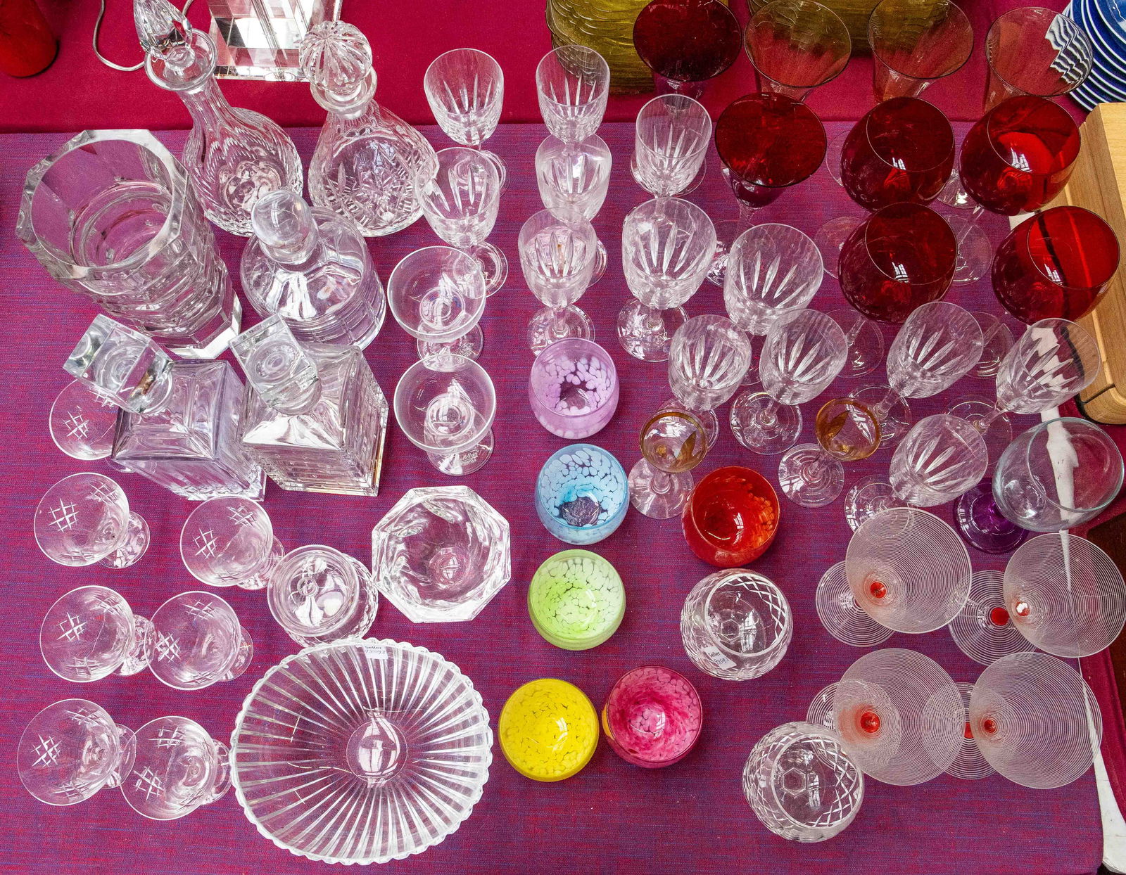 Lot of Assorted Crystal and Glass Drinkware.: This lot includes wine goblets, decanters, stemless wine glasses, brandy snifters, champagne flutes, bowls, and more. Some of the brands are Waterford, Atlantis, Kosta Boda, Reed & Barton, and more. A