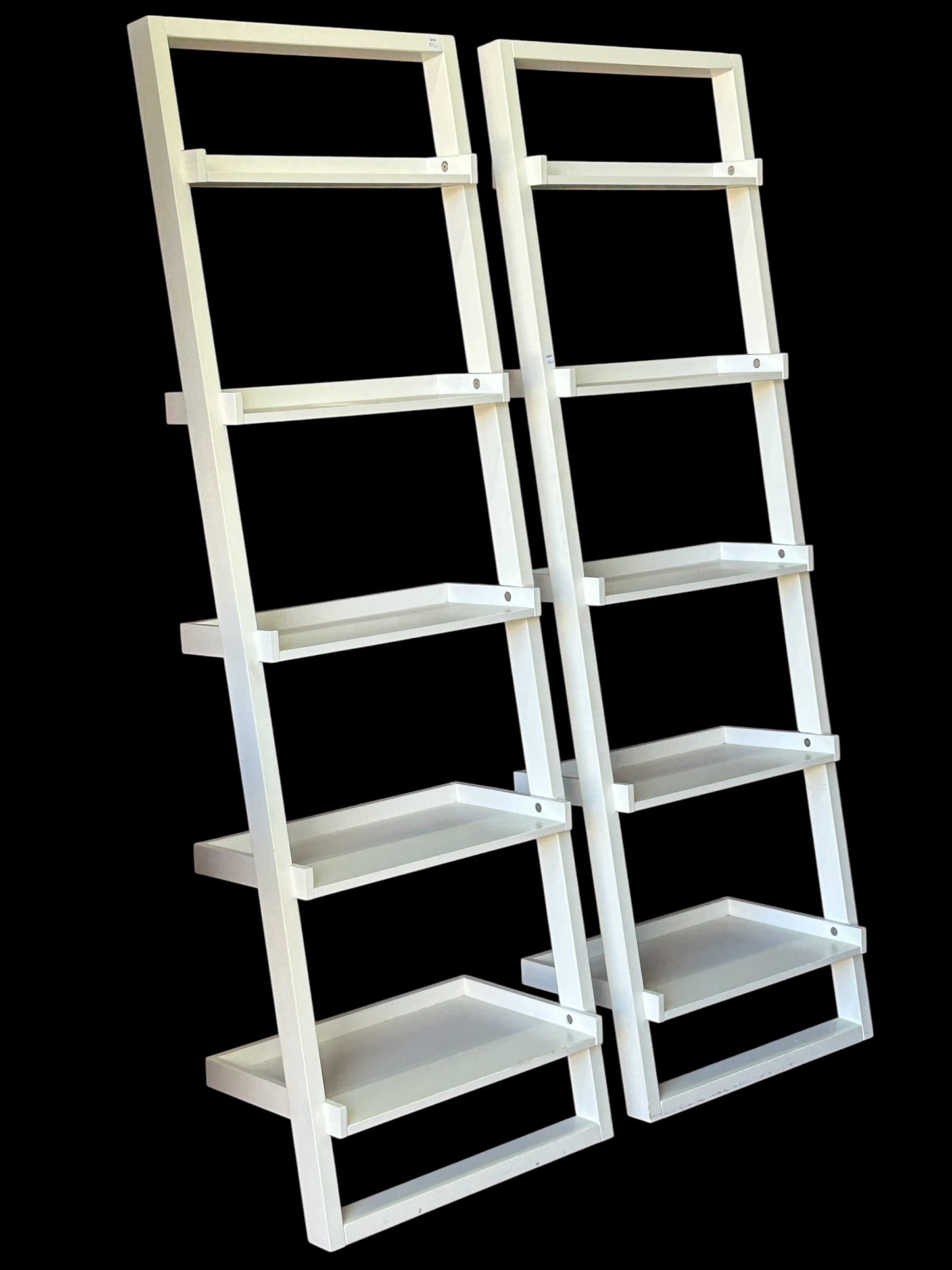 Pair of White Leaning Bookcases.: These bookcases must lean against something (they are not free-standing). Each one has five shelves. They are both in good condition, with only a few minor marks here and there. Each one measures 25 1