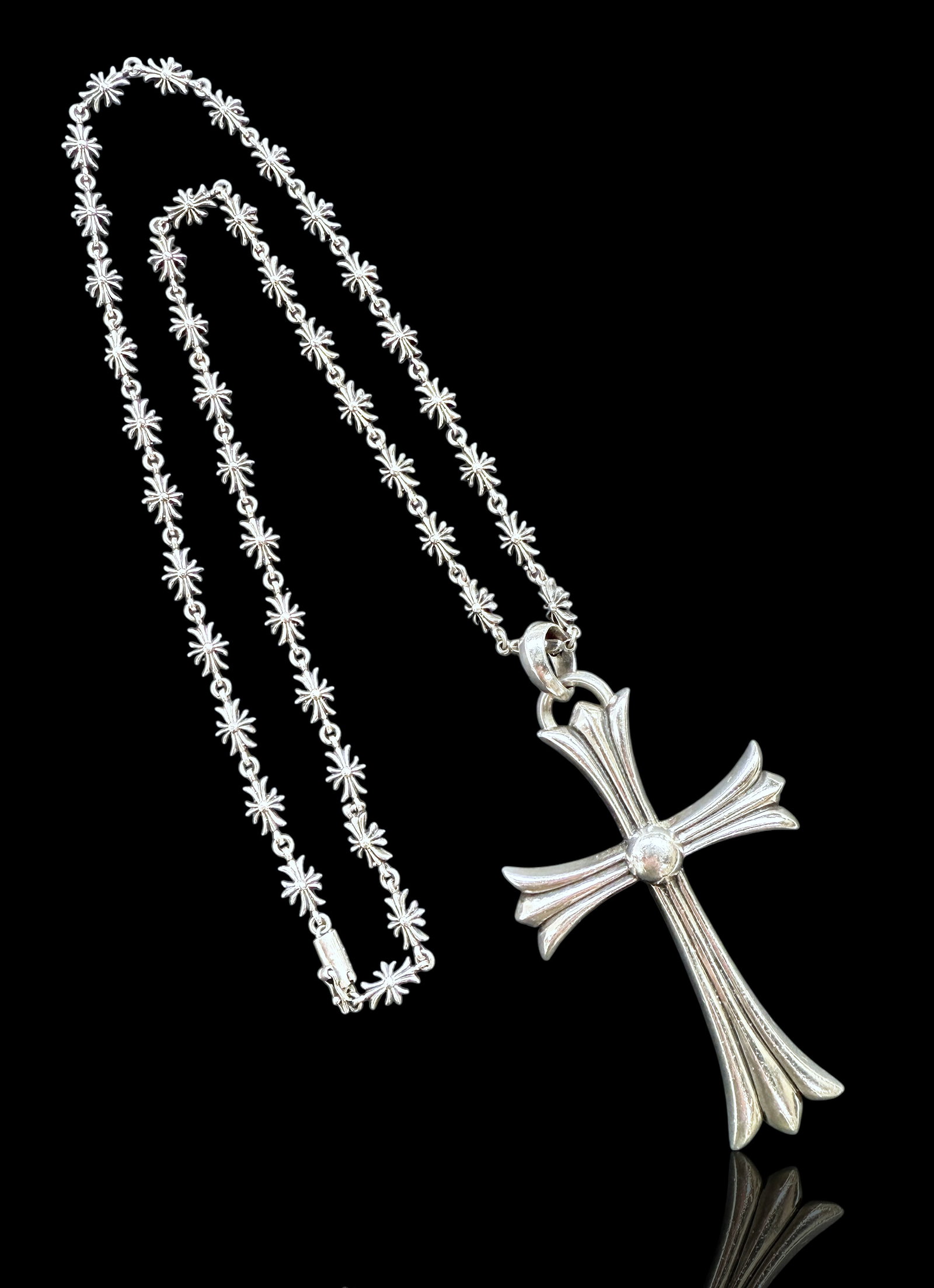 Large Chrome Hearts Silver Cross Pendant w/ Chain: The piece is signed on the back of the cross and also on the clasp. The cross and chain are in good overall condition, with some wear to use. The cross measures 3" long and 2" wide. The chain measures