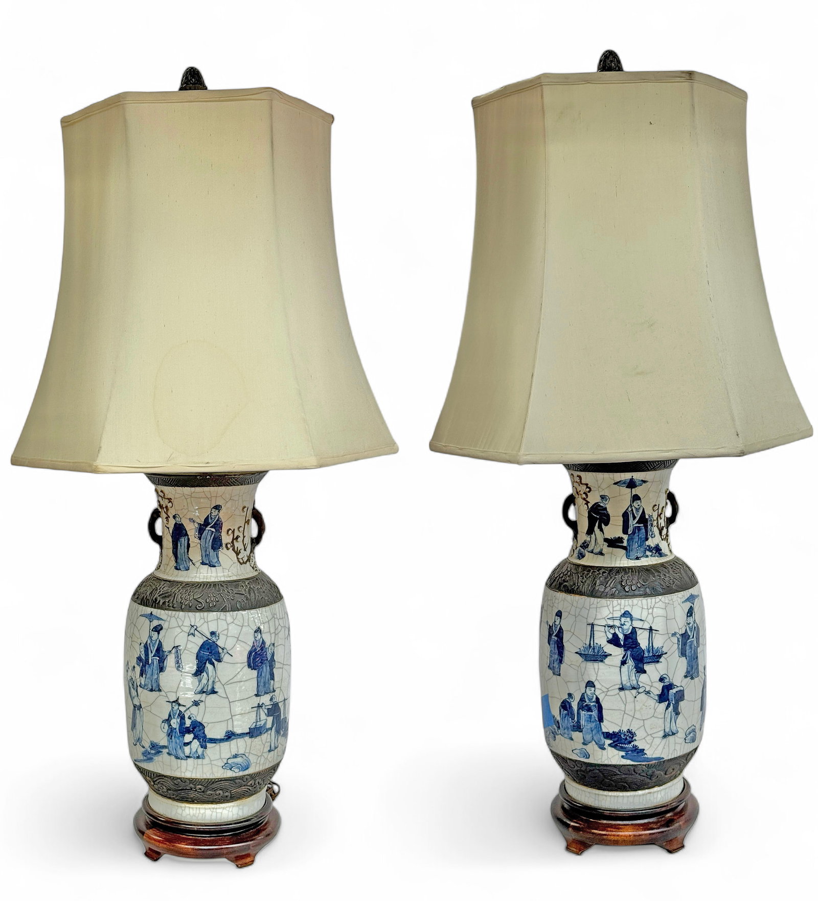 Pair of Late Qing Dynasty Porcelain Lamps.: The lamps look to be in good overall condition. Each porcelain vase section measures 17" tall and 8" in maximum diameter. The lamps measure 38 1/2" tall from base to top of finial. The shades have som