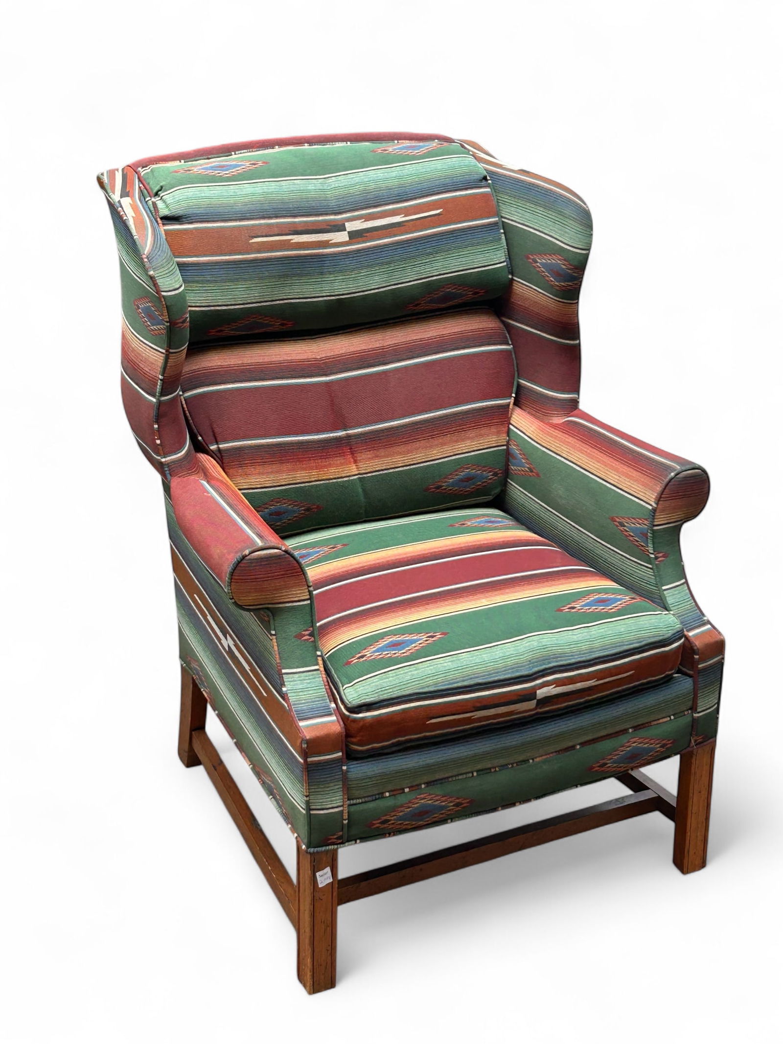 Wingback Chair with Southwest Style Upholstery.: The vintage chair features Southwest style upholstery, wooden legs with minimal designs, and a removable seat cushion. It measures 49 1/2" x 32 3/4" x 31 1/2". There are some scratches, indentations,