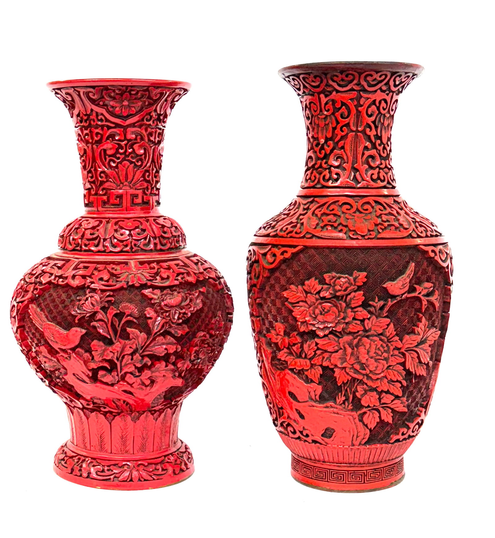 Lot of 2 Chinese Red Cinnebar Vases.: Both vases are in good overall condition, although the shorter one has a small loss (hard to notice). The taller one measures 12 5/8" in height, with a 6 1/4" maximum diameter. The smaller vase measur