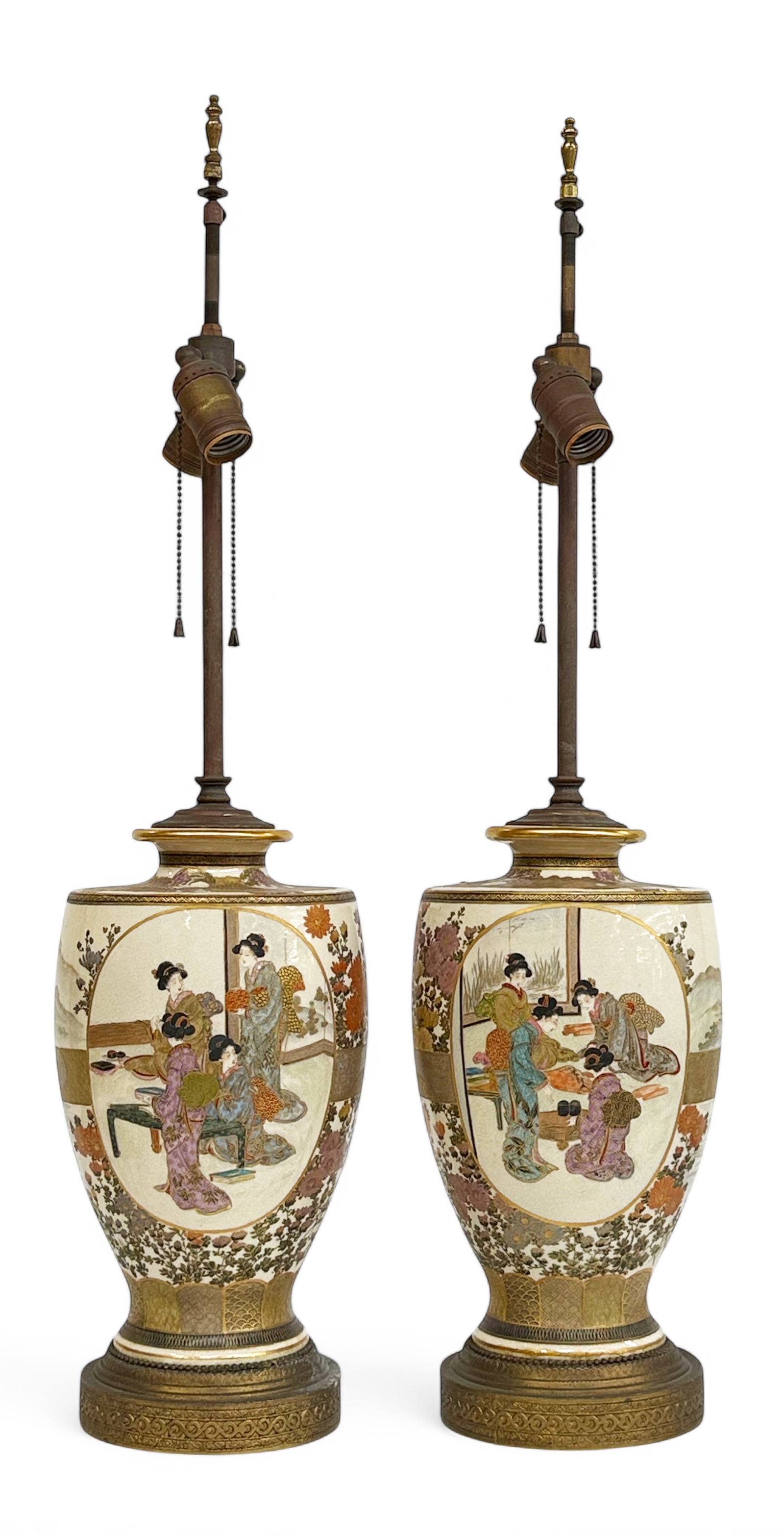 Pair of Old Japanese Satsuma Lamps.: The lamps are in good overall condition, but could use a cleaning. The center portions measure 11 3/4" long and 7" in diameter. The lamps as a whole measure 31" tall from base to top of finial. Third-