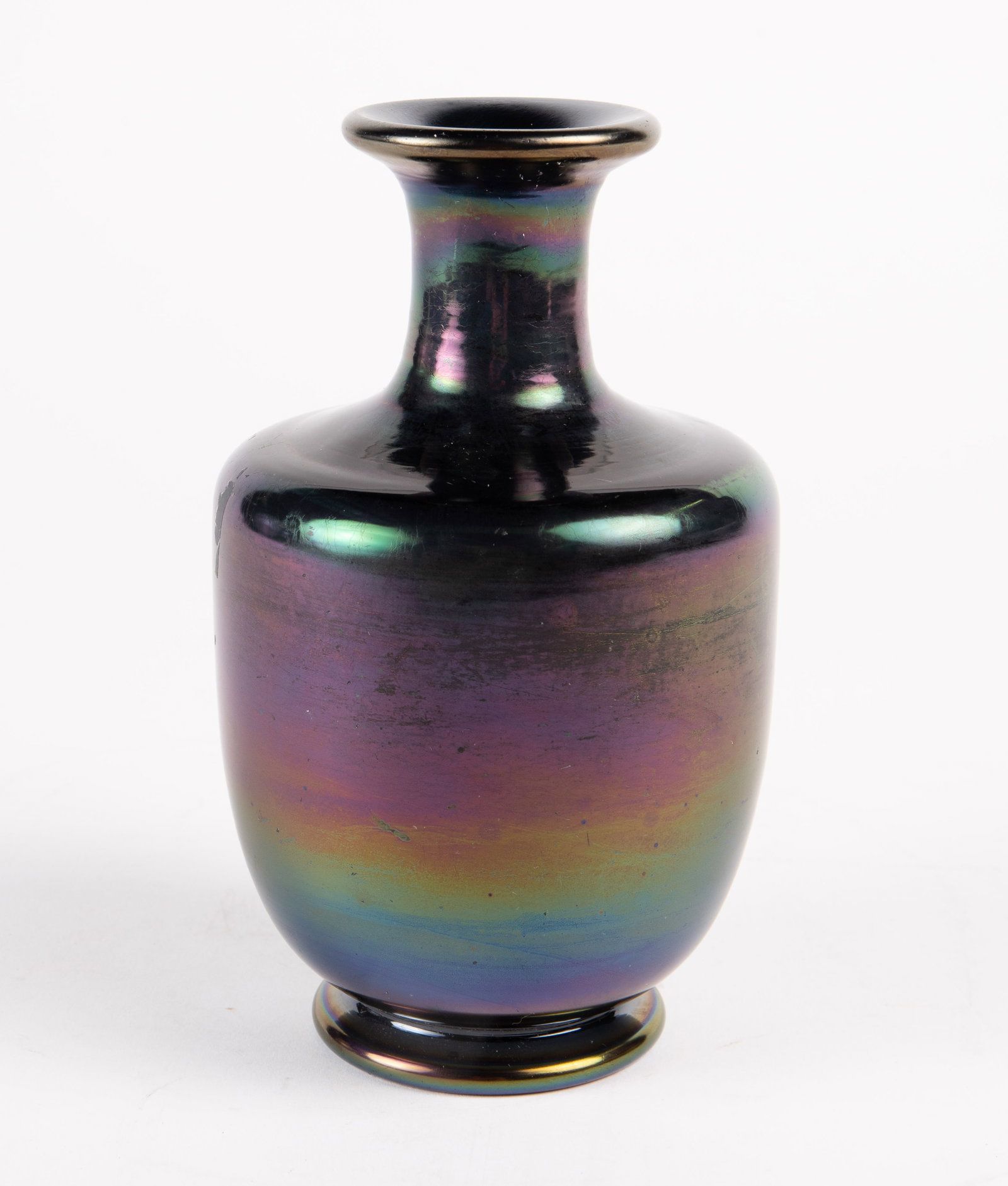 Thomas Webb Green Bronze Glass Vase.: The vase is attributed to Thomas Webb. The dark vase has an iridescent finish. It measures 7" x 4" x 4". There are some scratches and stains on the piece. Otherwise, it is in overall good condition. I