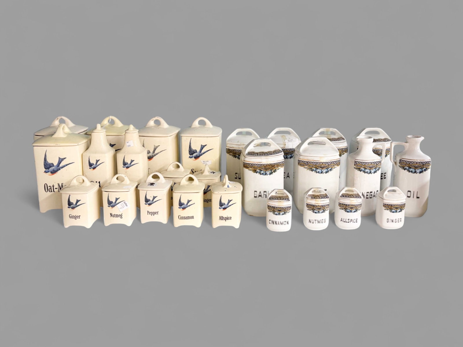 Lot of Vintage Porcelain Kitchen Canisters.: They are two separate sets; one is Czech. One is a set of 12, the other is a set of 14. The lot could use a good cleaning, and there are some small chips present. The largest item measures 9 1/4" tall