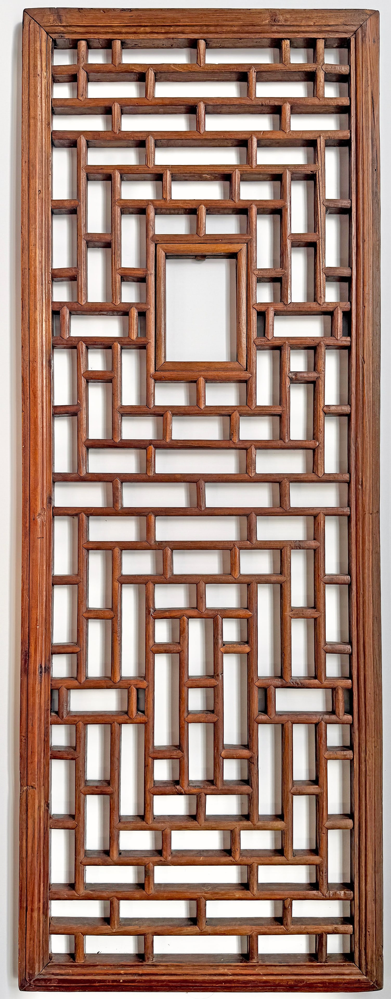 Vintage Chinese Wood Tracery Window Panel.: The panel looks to be in good overall condition, with a minor crack, and wear to use. There was something in the center, possibly a porcelain piece, that is no longer there. The window measures 52" x 