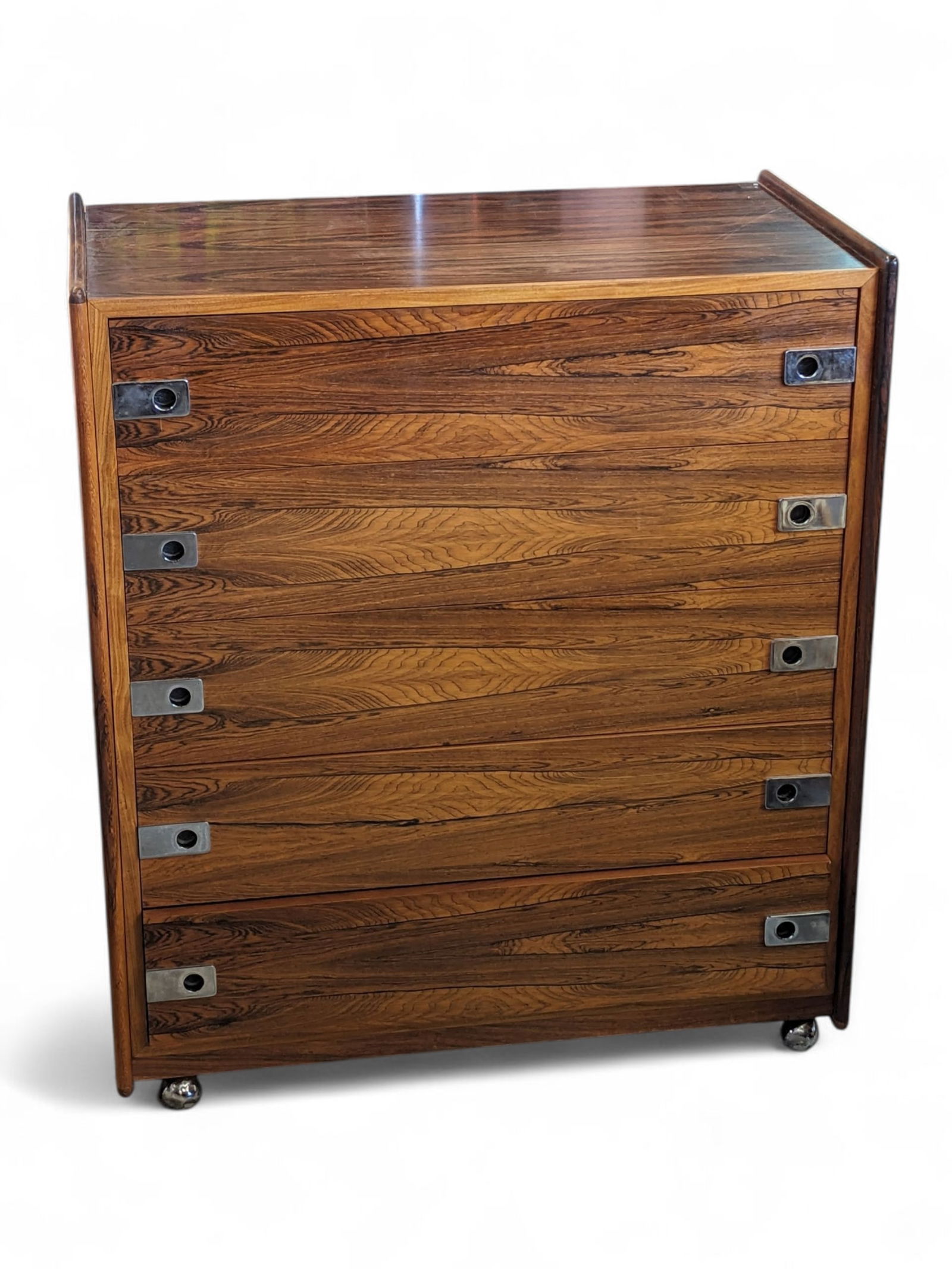 Vintage Arne Vodder Style Rolling Chest.: This Mid-Century Modern chest is manufactured by Inter-Continental Design of Canada (label on back). It has a rosewood veneer, five drawers with chrome pulls, and sits on casters. There are some scrat