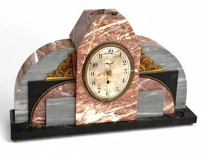 French Art Deco Mantel Clock, UCRA.: The vintage mantel clock features gray and red marble, accented by black slate or black stone. It is marked UCRA on the face and on the back. It measures 12" x 19" x 4 1/2". The black base is