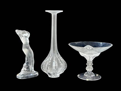 Lot of 3 Lalique Crystal Pcs.- Vases, Nude Figure.: This lot includes the following: a "Dans Beige" nude dancer sculpture, a "Virginia" Peacock compote bowl (some deep scratches), and a Marie-Claude Lalique signed soliflore base with bulbous bottom.