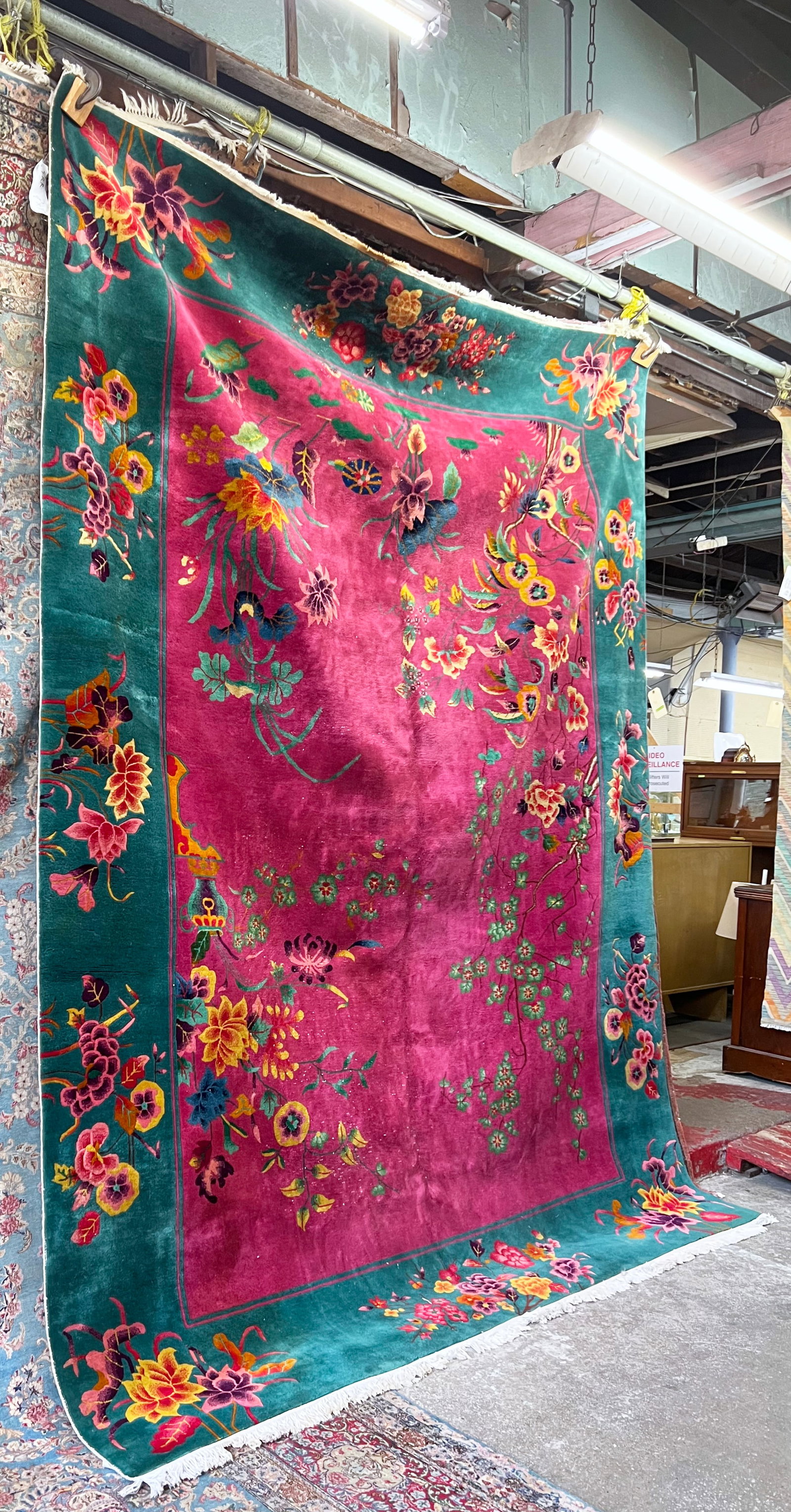 9' x 11' 9" Art Deco Chinese Rug.: The rug is very colorful. It has some white knots, but is in good overall condition. In-house shipping is available for this rug. Please see our website about in house shipping procedures.
