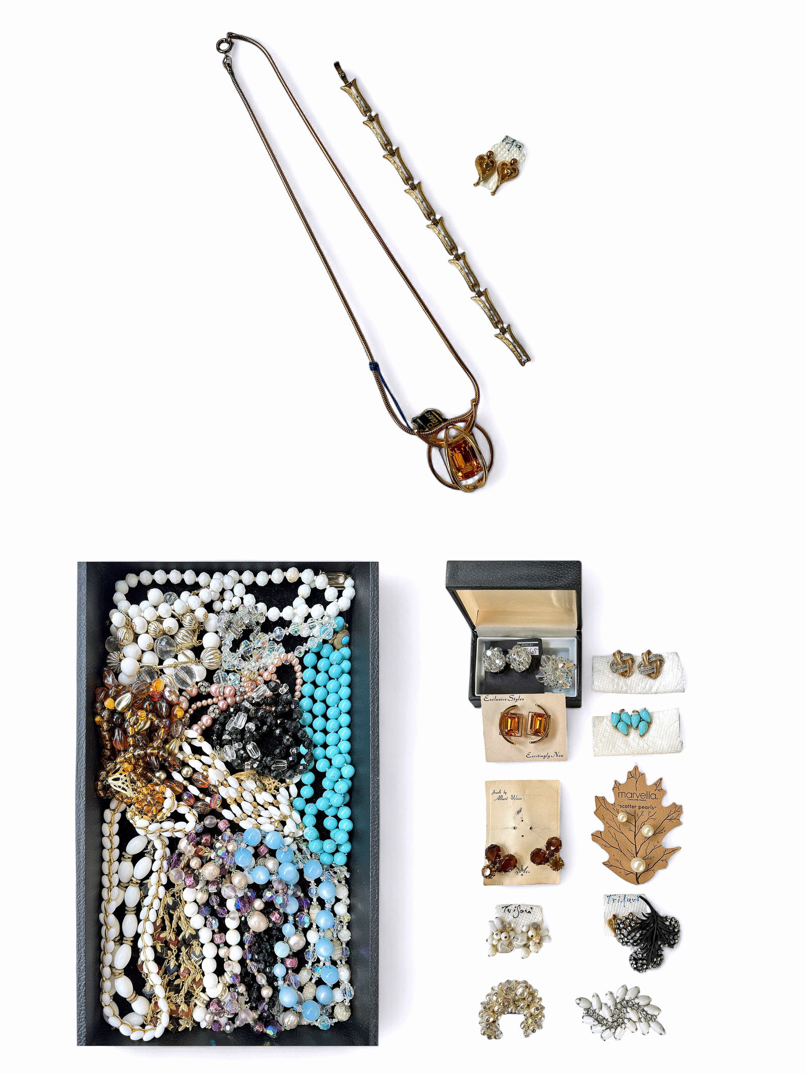 Lot of Vintage Costume Jewelry - Trifari, Bernard.: The lot contains over 30 pieces of costume jewelry, including two 2 piece sets. There are necklaces, earrings, brooches, and bracelets. The marks observed on the pieces are Castlecliff, Trifari, Lagun