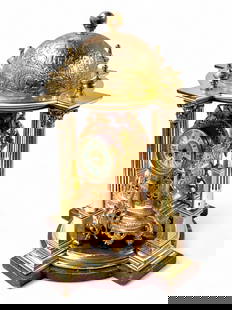 French Baroque Gilt Bronze Clock w/ Surround.: The hollow clock features fan and scroll designs with pierced areas and 5 legs. It has a beveled crystal to protect the porcelain face. It is displayed inside of a brass domed open case with columns,