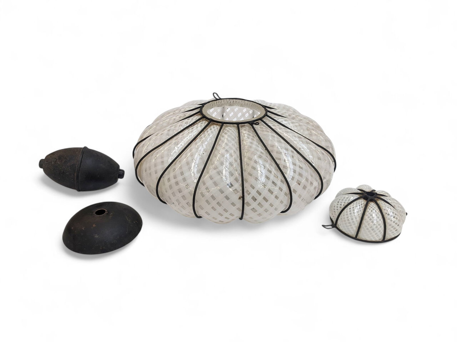 Venetian Murano Latticino Caged Pendant Light.: The blown glass pendant light features a white lattice design on a clear background. It is surrounded by an iron cage, which results in a ribbed design around the piece. It measures 9 1/4" x 13 1/2" x