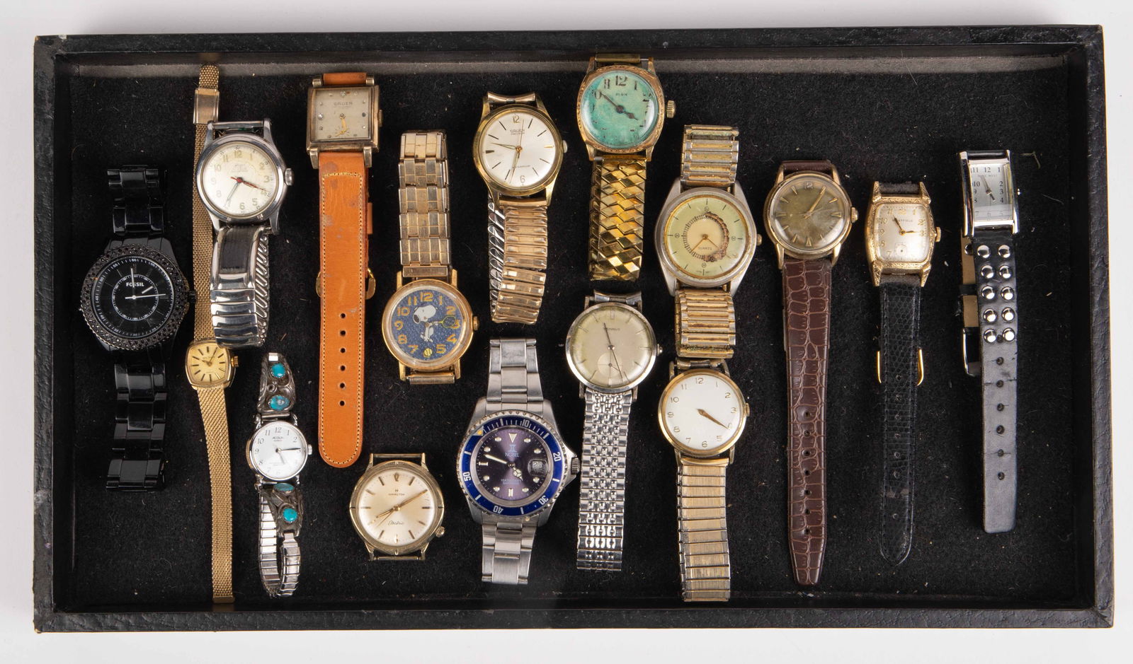 Lot: 16 Wristwatches, inc. Richard Begay 925 Band.: The lot contains 16 wristwatches, one of them without a band. The lot features an Acqua quartz watch with a Navajo Richard Begay band with turquoise stones. The other watches included are Nine West, W