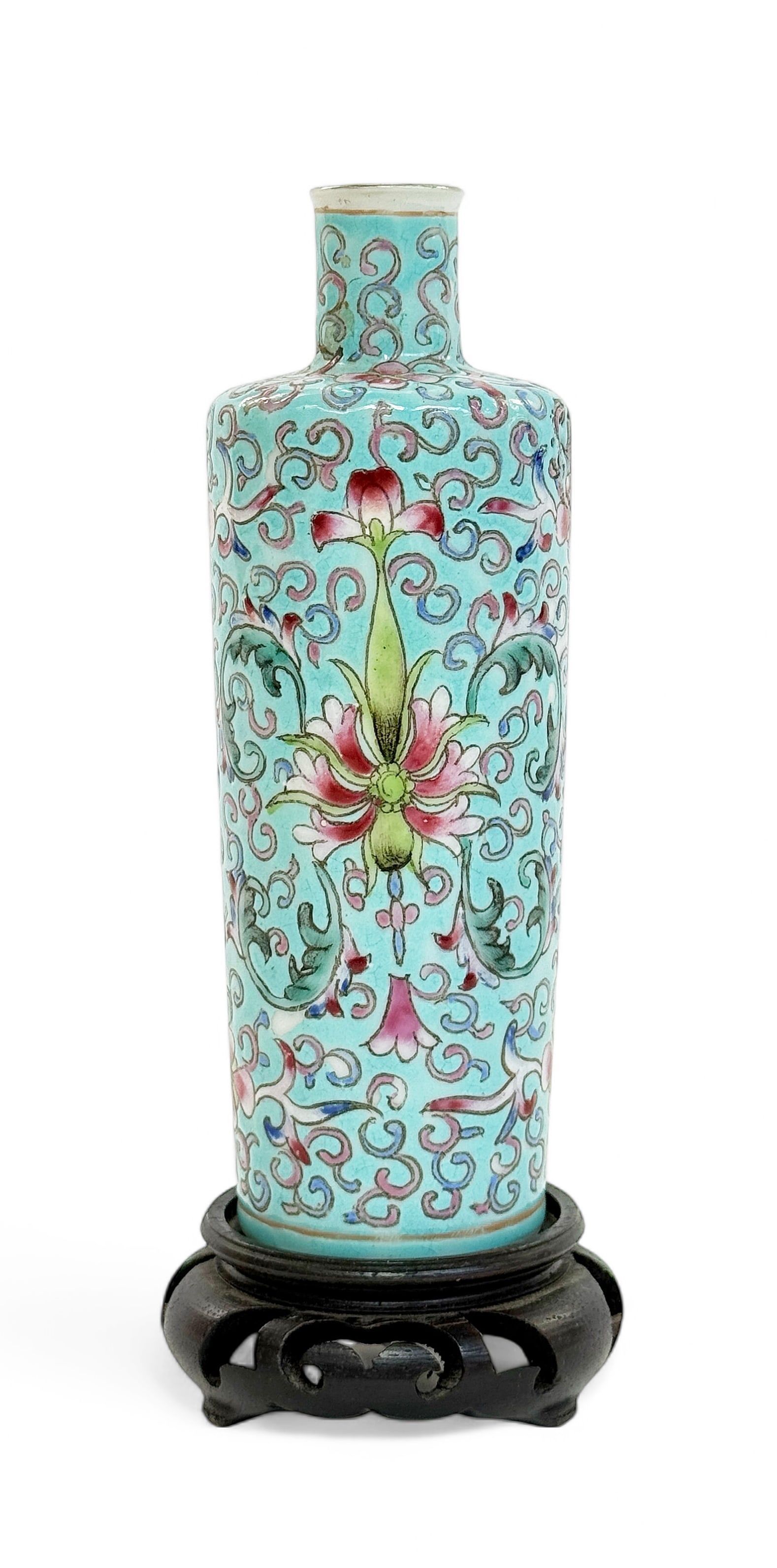 Qing Dynasty Chinese Porcelain Famille Rose Vase.: The vase measures just over 5 1/2" tall and 1 7/8" in diameter. It comes with a wood carved stand. The vase has a 4 character mark on its underside. It has a tiny bit of glaze loss in one spot. Otherw