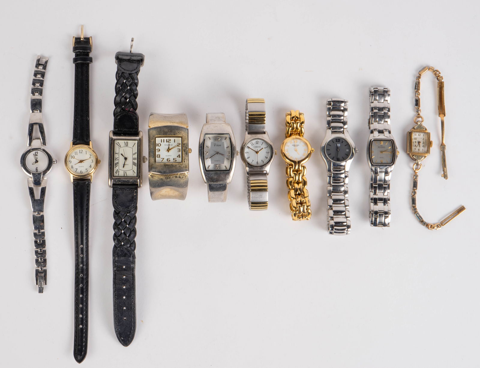 Lot of 10 Wristwatches - Waltham, ESQ.: The lot contains 10 wristwatches. The items are Waltham with 4 small diamonds, Carriage by Timex, Raymond Weil Geneve, Vivani, ESQ, Skagen, and Studio Time. Some of the items are unbranded. The smalle