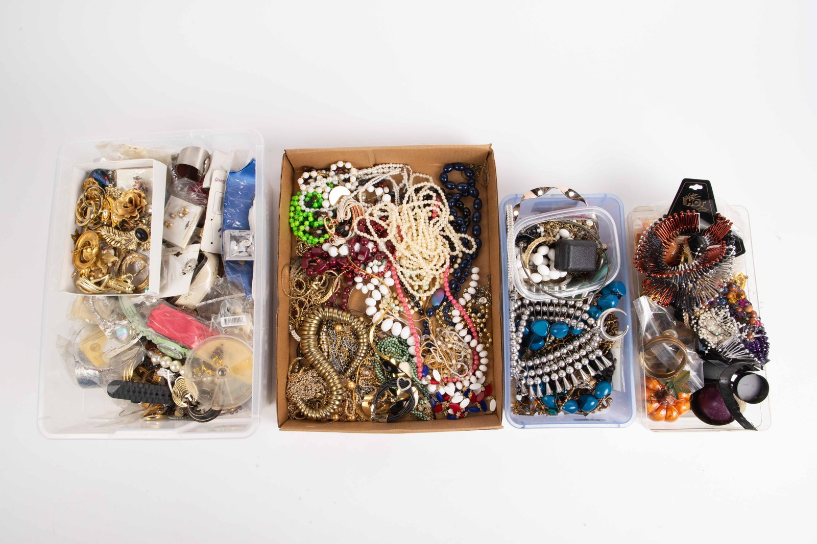Lot of Costume Jewelry, Some Signed.: The lot contains over 100 pieces of jewelry. There are necklaces, bracelets, brooches, earrings, a few watches, rings, and more. Some of the brands or marks observed in the lot are Pell, Japan, Earth 