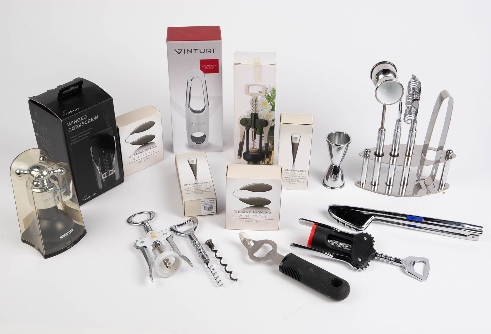 Lot of Assorted Bar Accessories & Tools.: The lot contains 15 items. The following items are in their original boxes: 2 foil cutters and 2 wine stoppers, a Rabbit winged corkscrew by William Sonoma, a Vinturi champagne opener, a Studio Nova c