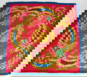 Hermes "Kosmima" Silk Scarf.: The scarf looks to be in overall nice condition, though it has some dark stains, which could perhaps be cleaned. The main colors in the design are red, blue, and gold. The scarf measures 34" x 35". In