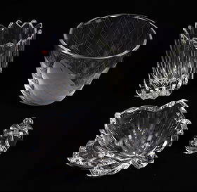 Lot of Swedish Crystal Pcs- Orrefors, Johannesfors: This lot includes a Johannesfors fish bowl, and three Orrefors pieces- a perfume bottle with stopper, a leaf-shaped bowl, and a faceted vase. The perfume bottle has a small chip at the bottom, but ove