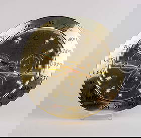 Rolex Oyster Perpetual Daytona Wall Clock - Gold.: The Rolex dealer display is no. A6409 in a gold finished metal. The clock face reads, "Rolex Oyster Perpetual Superlative Chronometer Cosmograph Swiss Made". It is a quartz battery operated wall clock