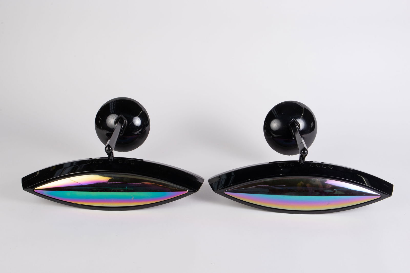 Pair of Fabio Lombardo for FLOS Italy AETO Sconces: These iridescent wall sconces have some scratches and general surface wear. Otherwise, they look to be in good condition. Each one measures 18 3/4" x 8 12" x 10". In-house shipping is available. Pleas