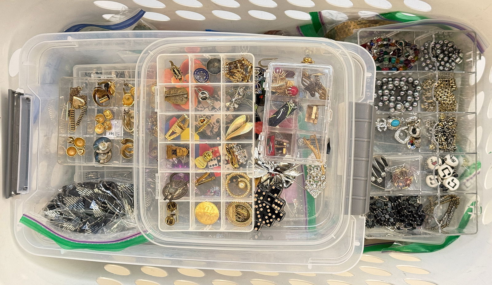 Huge Lot of Costume Jewelry - Chagnon, Ciner, Etc.: The lot contains over 150 pieces of costume jewelry, including some necklace and earring sets, an Anne Marie Chagnon necklace, and a Ciner brooch. There are necklaces, earrings, brooches, pins, bracel