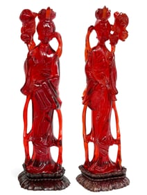 Pair of Carved Reconstituted Cherry Amber Figures.
