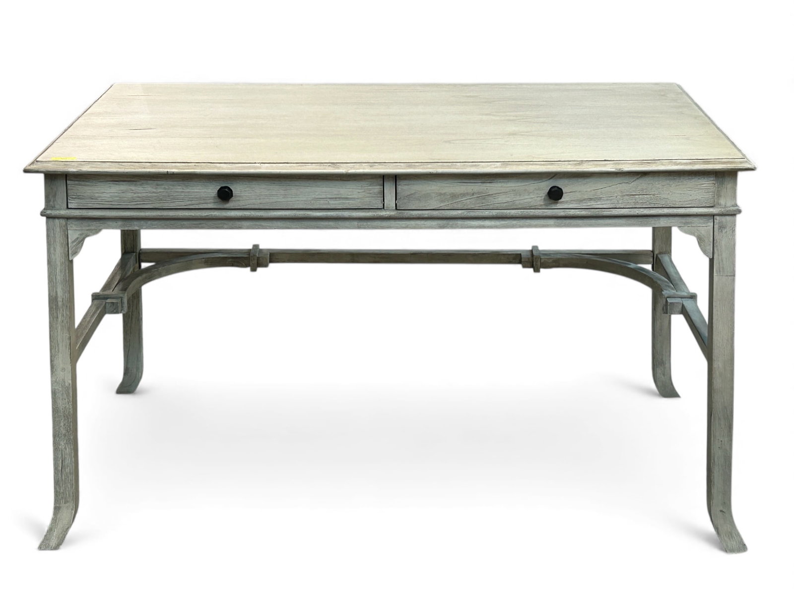 Uttermost Bridgely Writing Desk.: This carved mango wood desk has two drawers with brass pulls. It is in good condition, with some minor wear. The piece measures 52" wide, 27" deep, and 30" tall. Third-party freight shipping or person