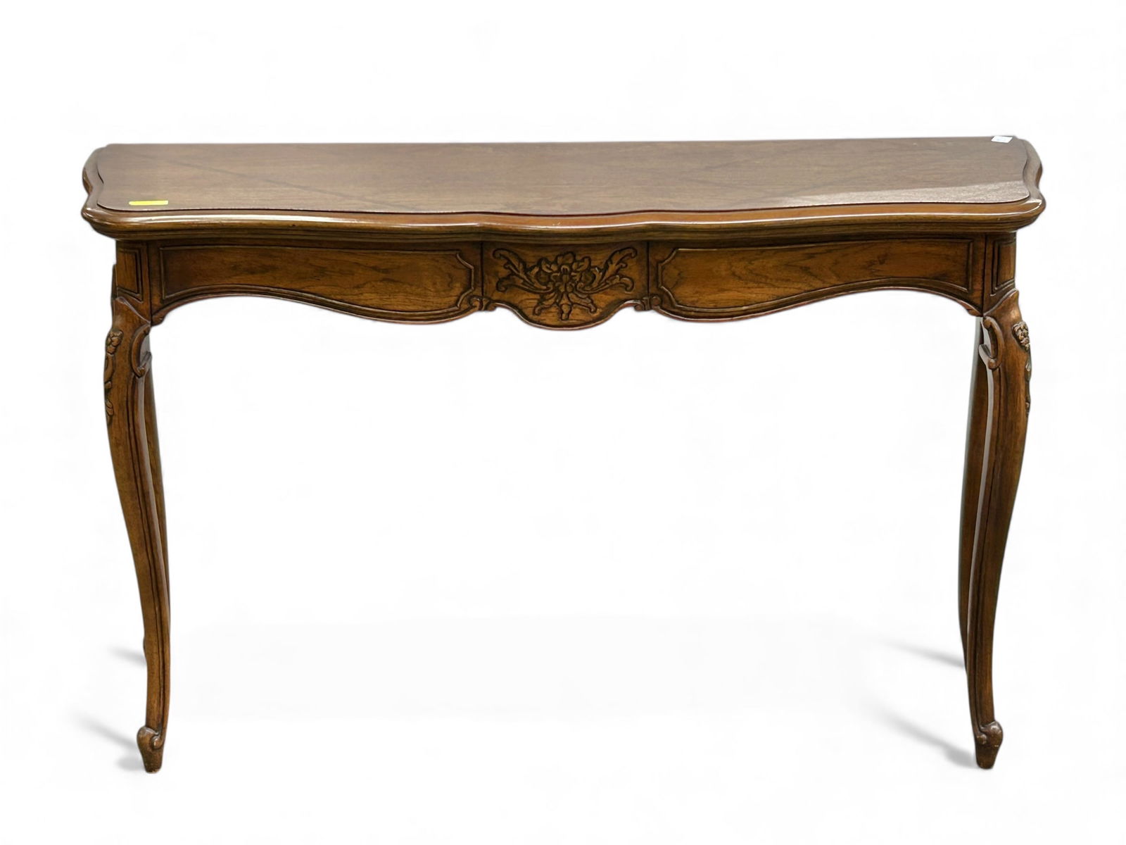 Carved Console Table - Thomasville.: This console or hall table has floral carvings, and sits on cabriole legs. It is signed on the bottom. The piece is in good condition, with some minor surface wear. It measures 48" wide, 12 1/2" deep,