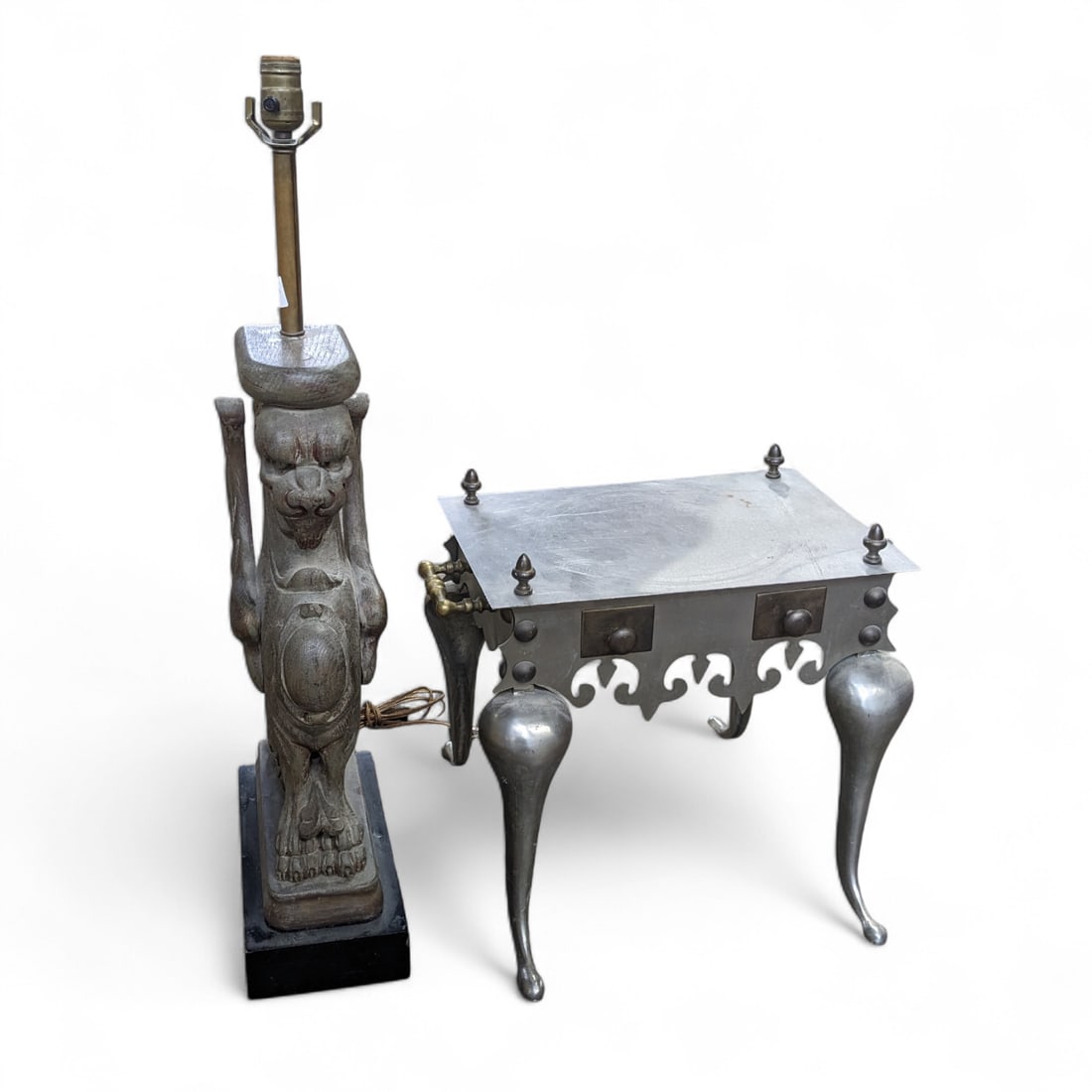 Fireplace Footman & Carved Griffon Lamp.: The metal footman has brass side handles and finials. It is in good condition. It measures 18" wide, 13 1/2" deep, and 17" tall. The carved griffon lamp has a few small cracks, but is in good shape ov