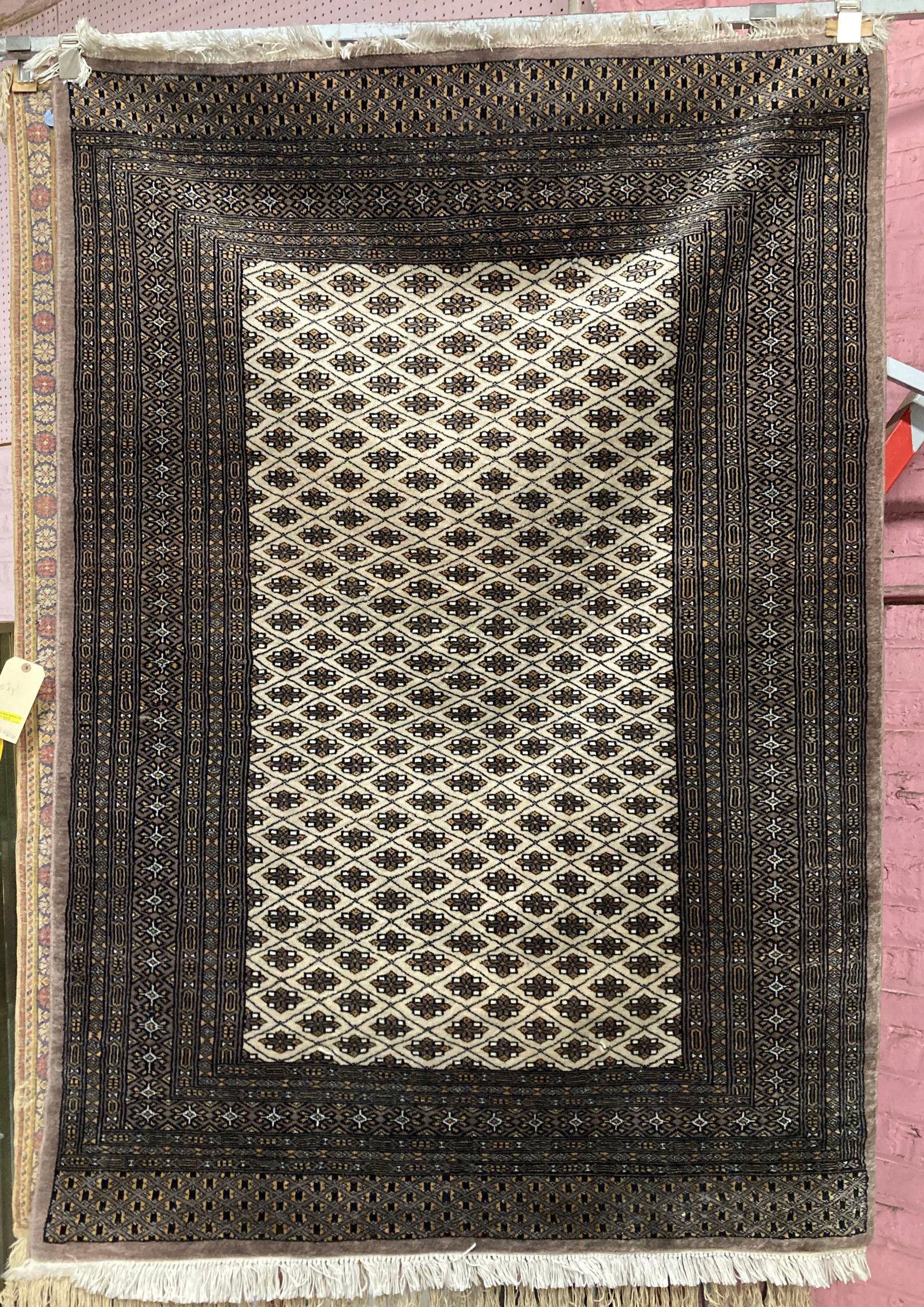 4' 1" x 5' 11" Bokhara Rug.: This thin handwoven rug looks to be in good overall condition. In-house shipping is available for this rug. Please see our website about in house shipping procedures.